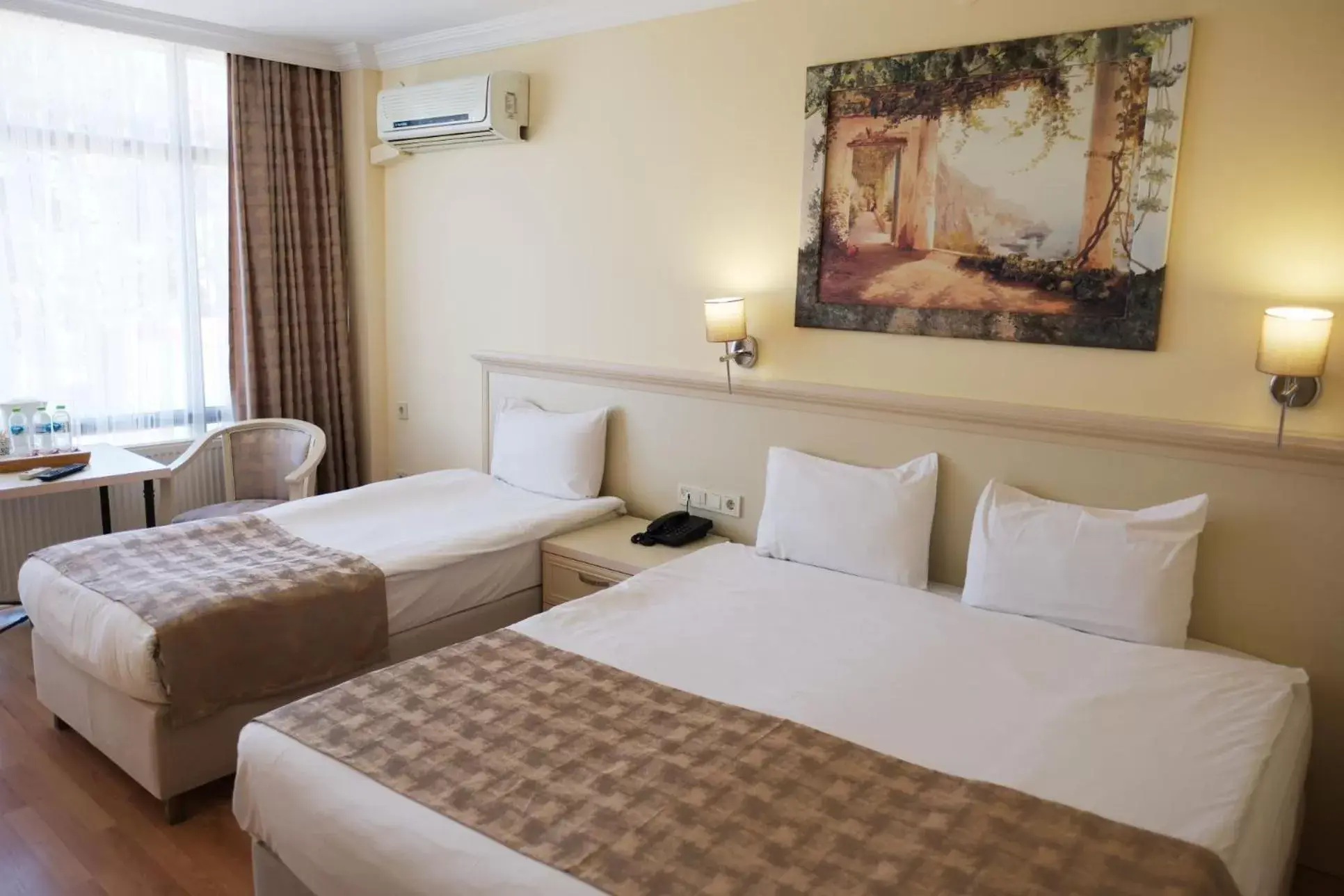 Bed in Troia Tusan Hotel