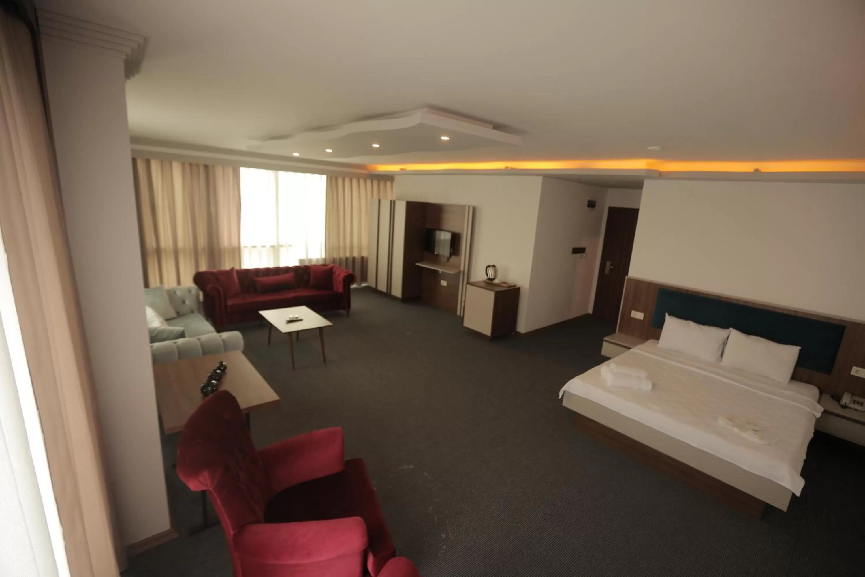 Bed in TEVETOGLU HOTEL