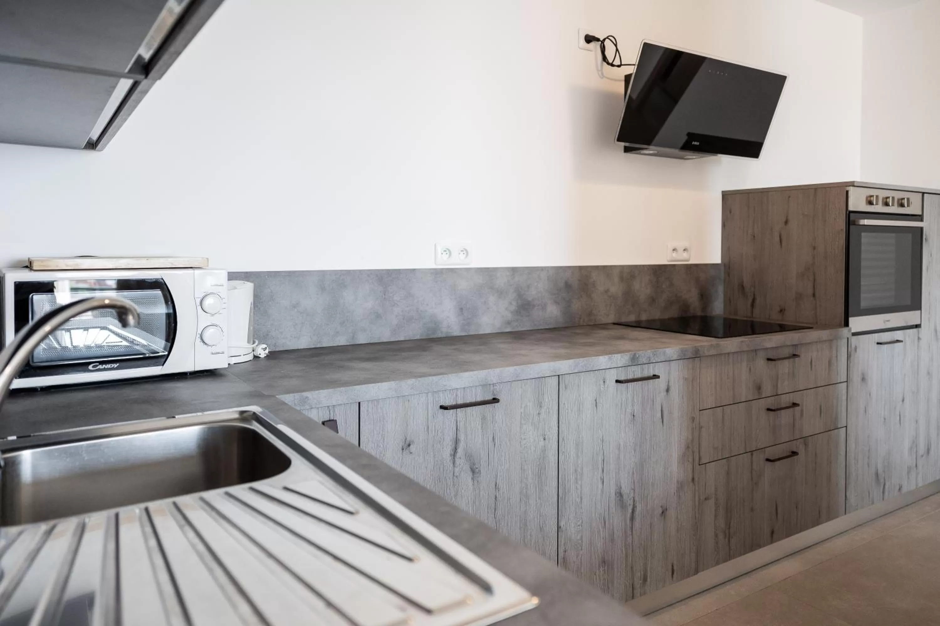 Kitchen or kitchenette in Hôtel Le Bastia
