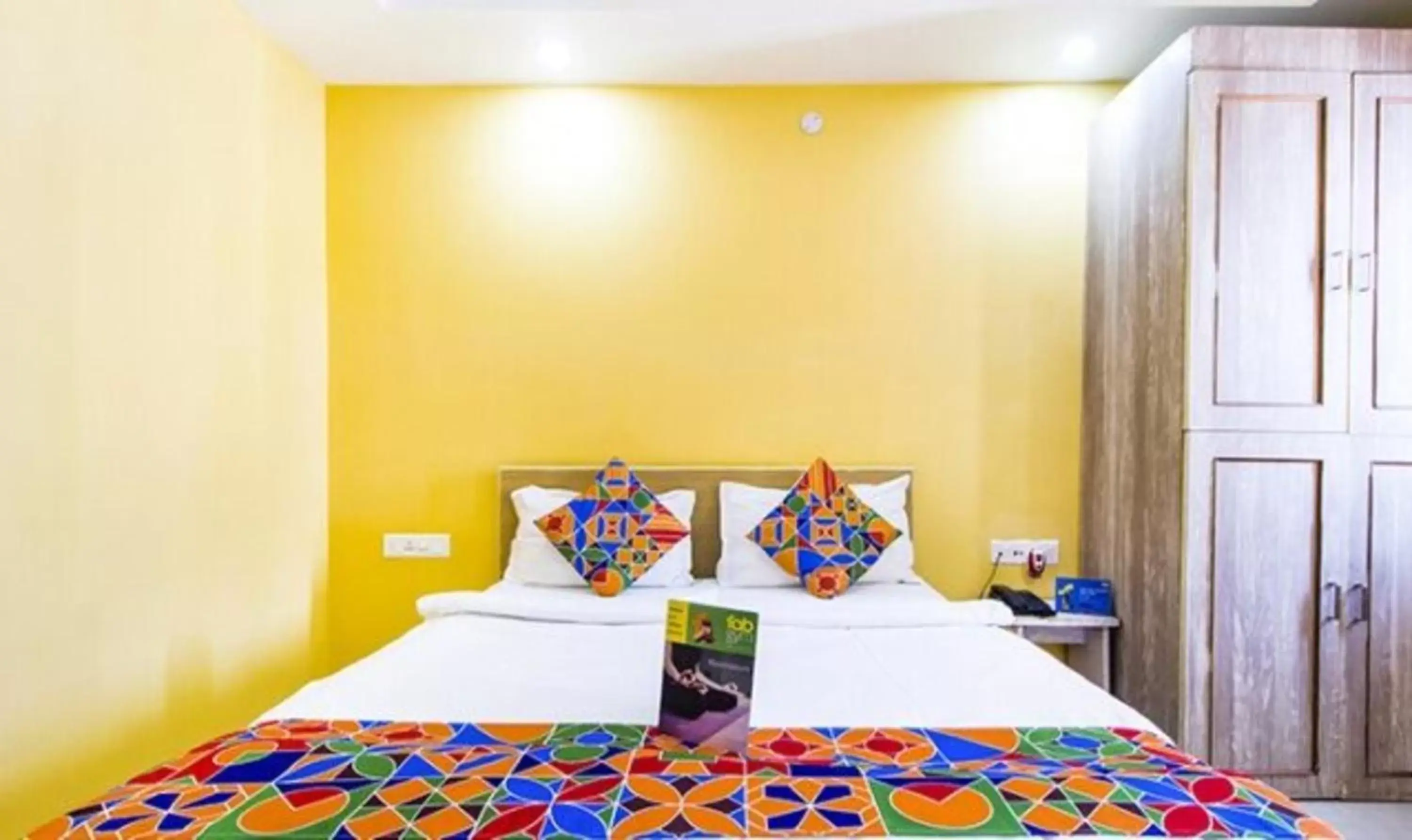 Bed in FabHotel Amaltas