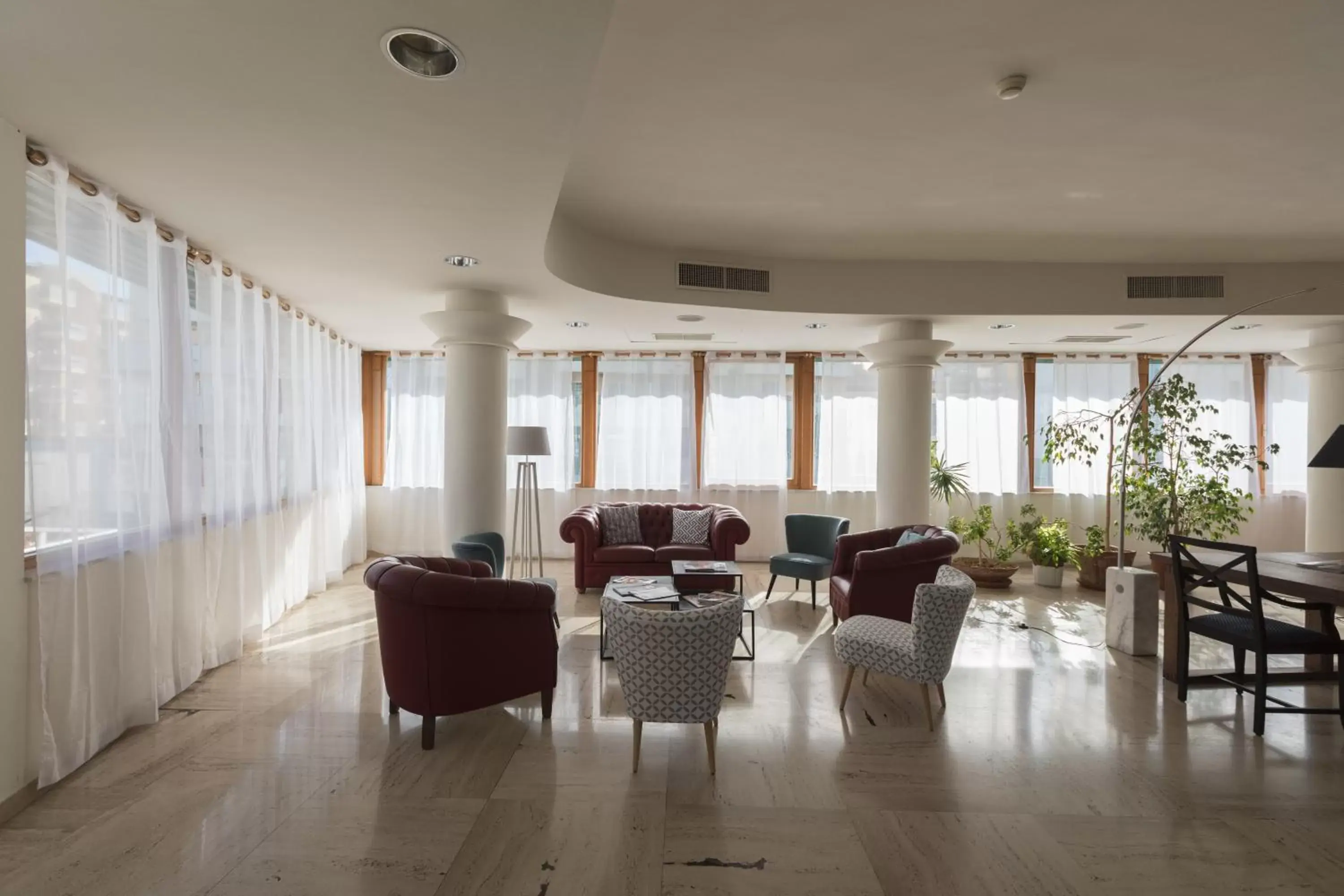 Communal lounge/ TV room in Hotel La Baia