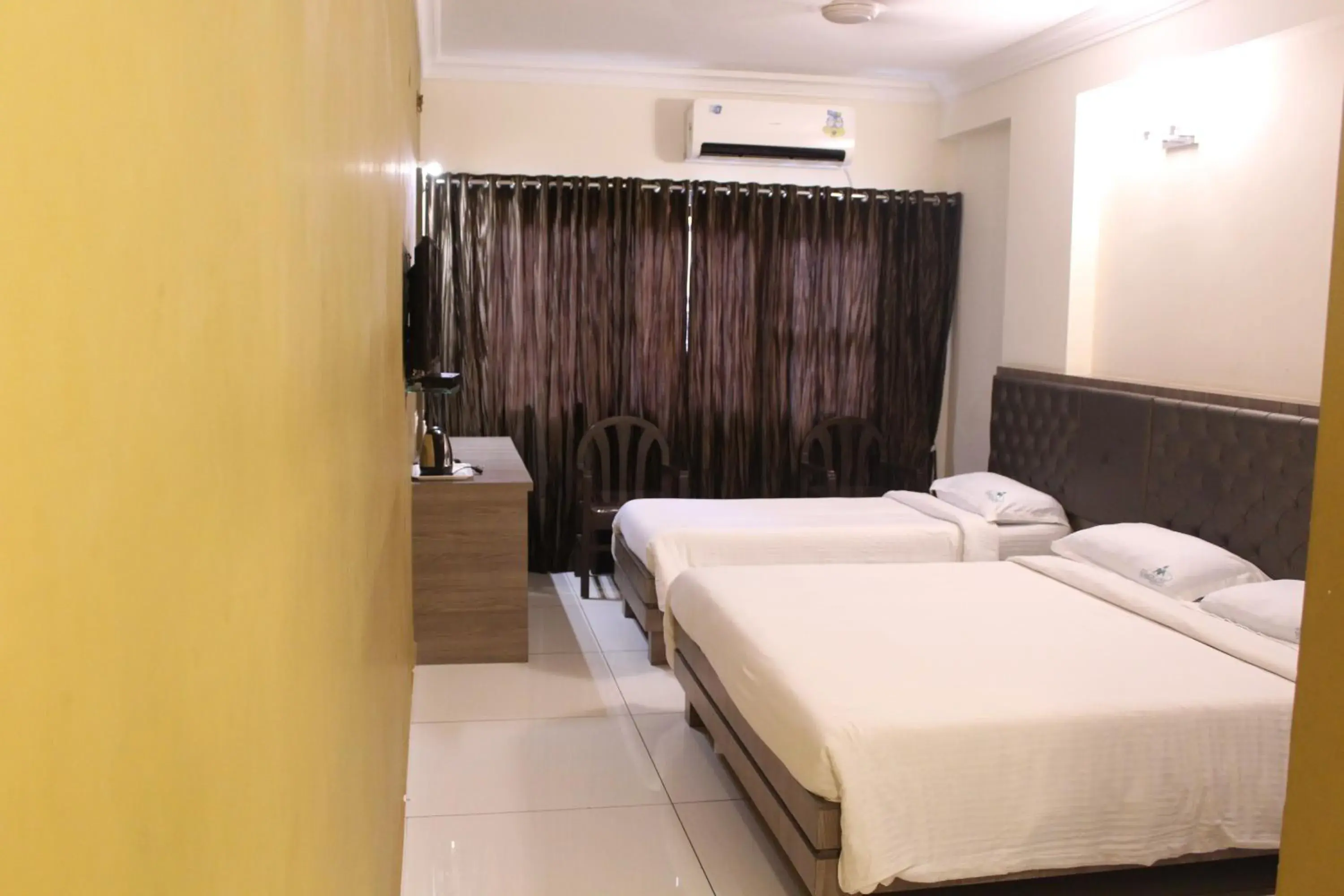 Photo of the whole room, Bed in Hotel Mangalore International
