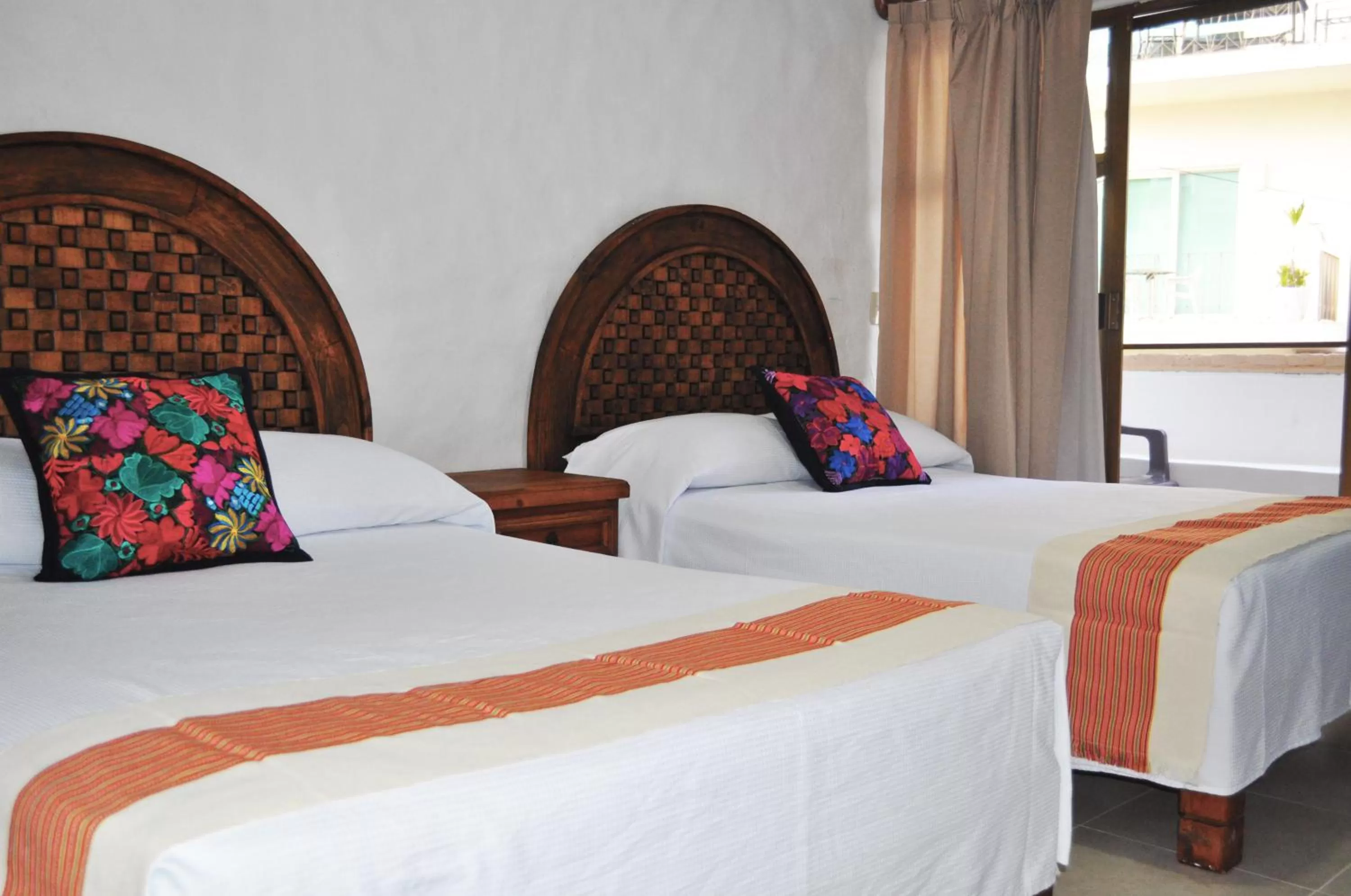 Bed in Petit Hotel Pilitas