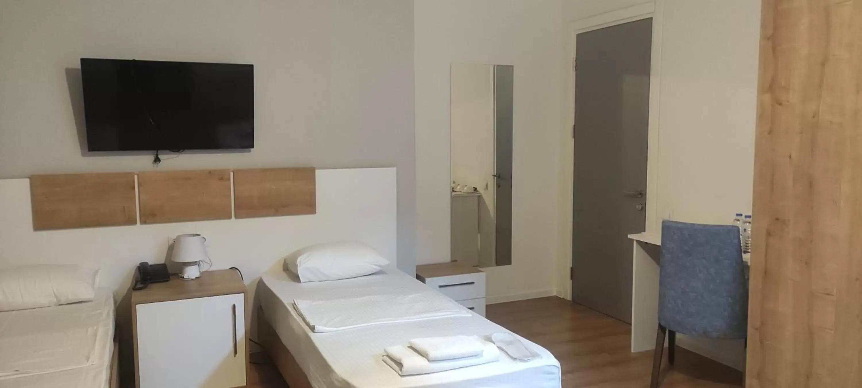 Bed, TV/Entertainment Center in Boho Tiflis Hotel