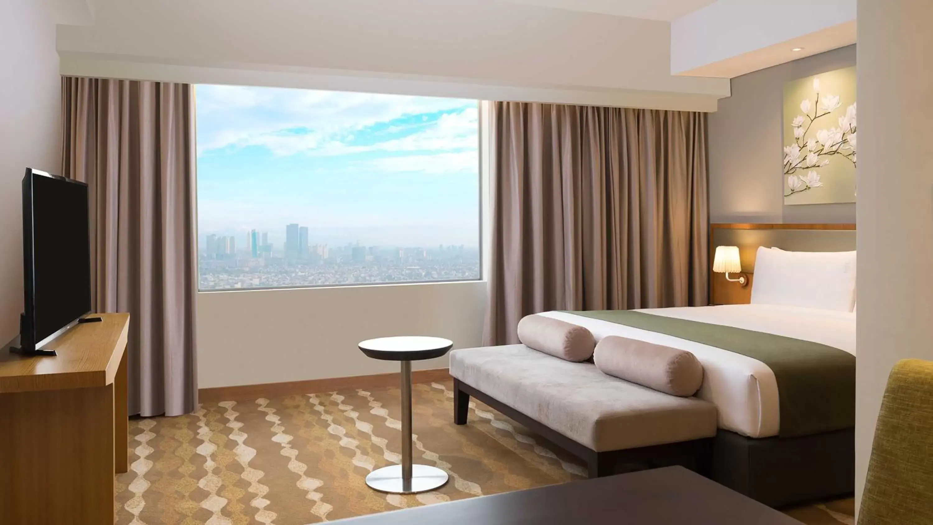 Bedroom in Holiday Inn & Suites Jakarta Gajah Mada, an IHG Hotel
