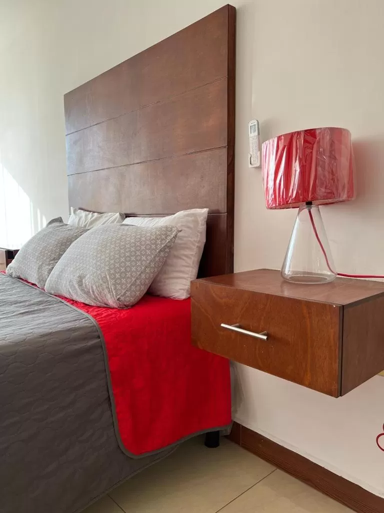 Bed in Departamentos Bonsai
