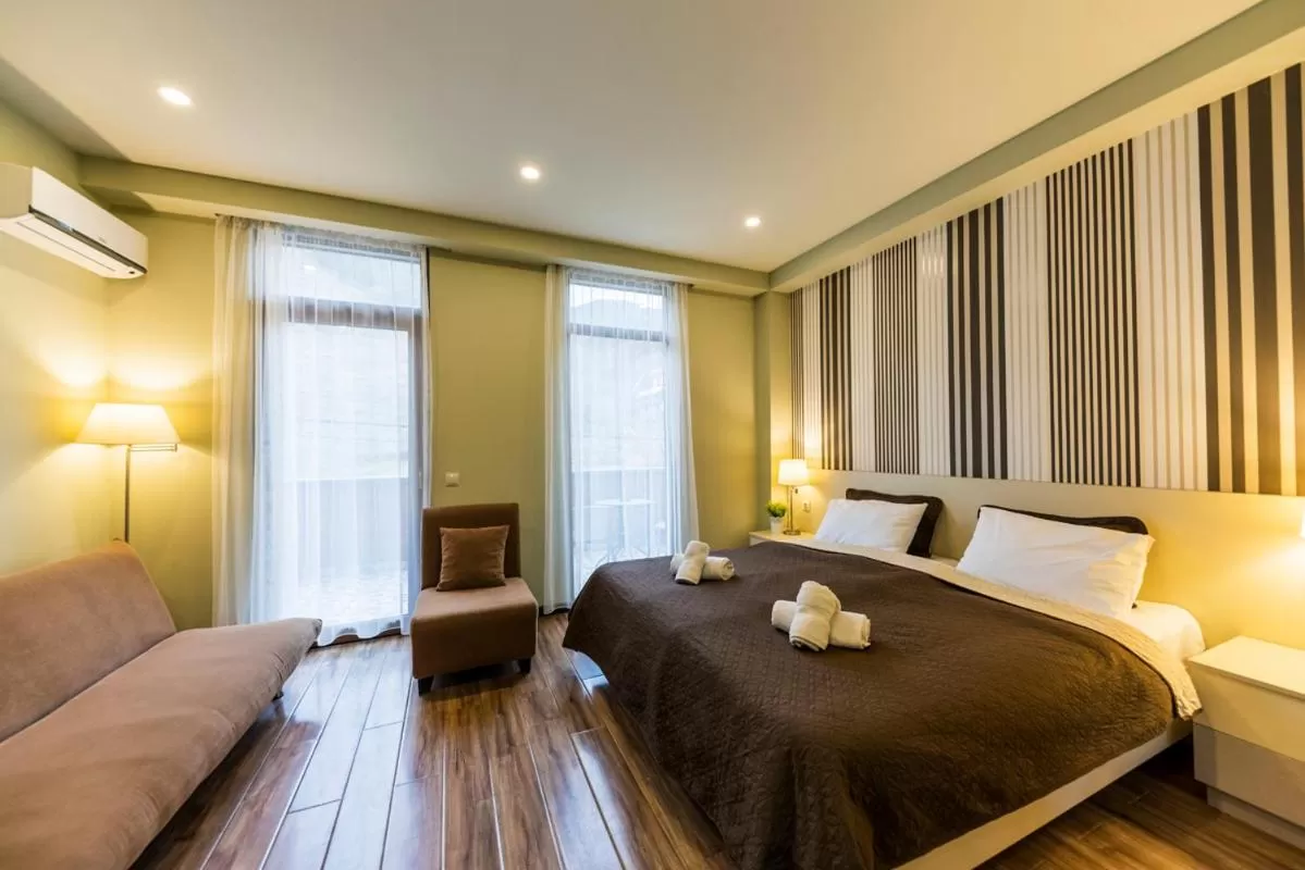 Bed in Sani Apart Hotel