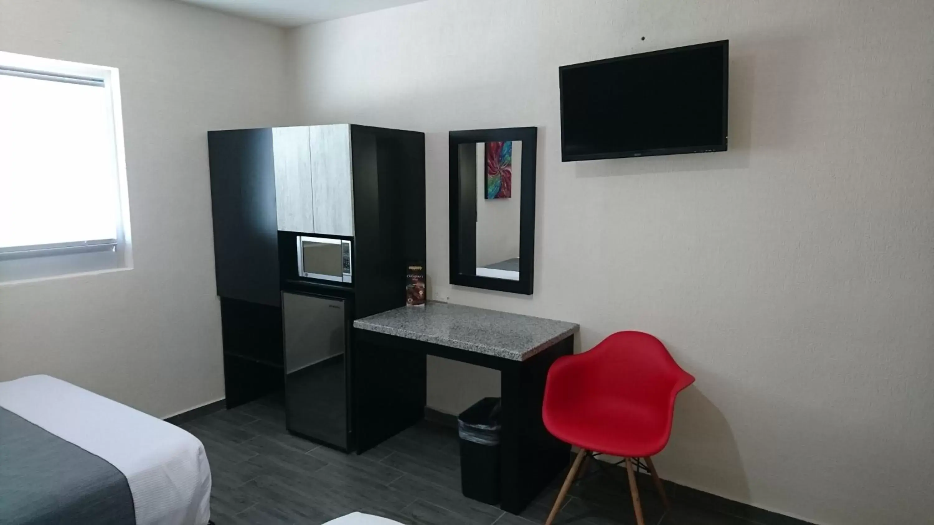 Photo of the whole room, TV/Entertainment Center in Homesuites Rotarismo