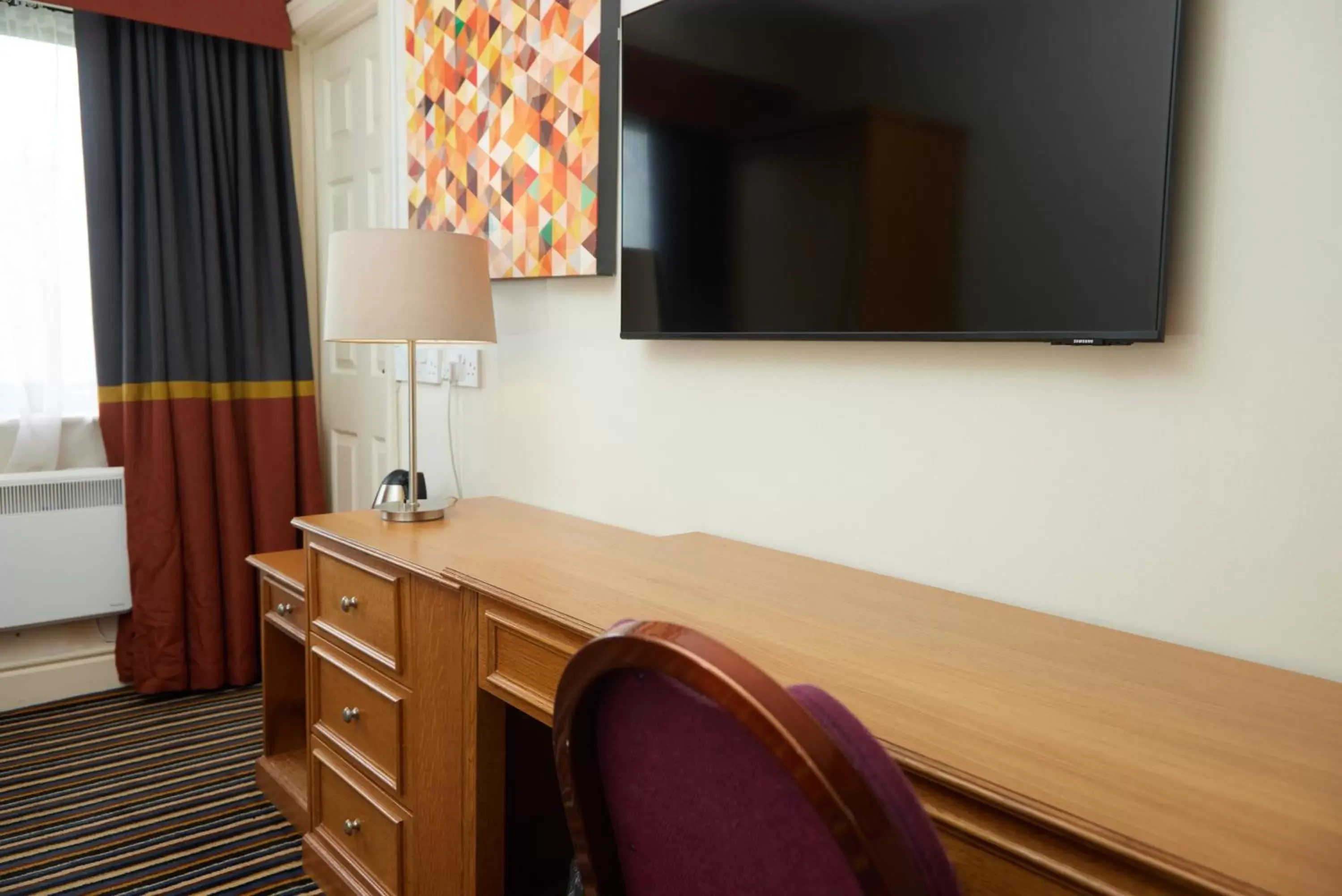 Bedroom, TV/Entertainment Center in The Broughton Hotel by Greene King Inns