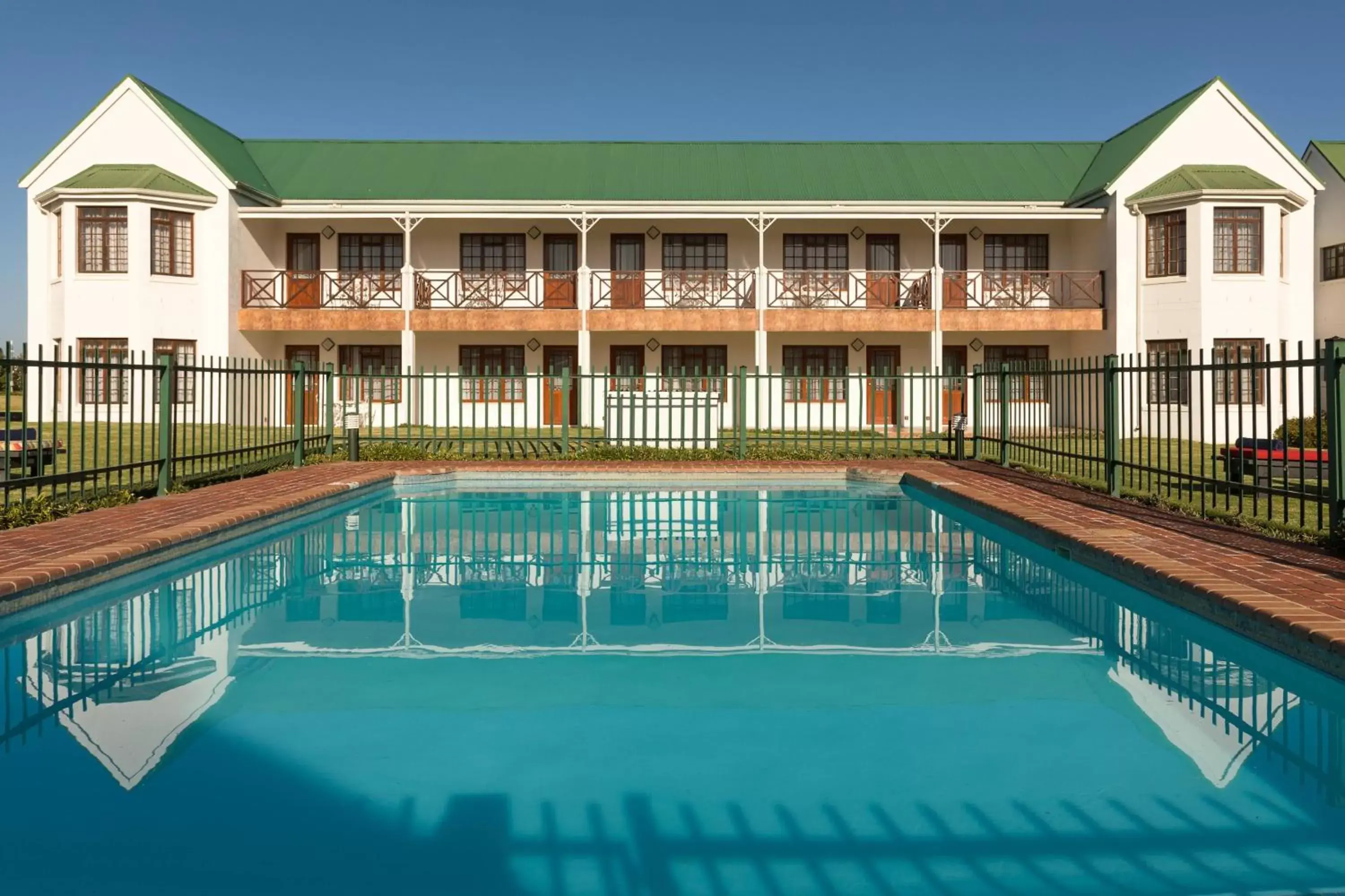 Swimming pool, Property Building in Protea Hotel by Marriott George King George