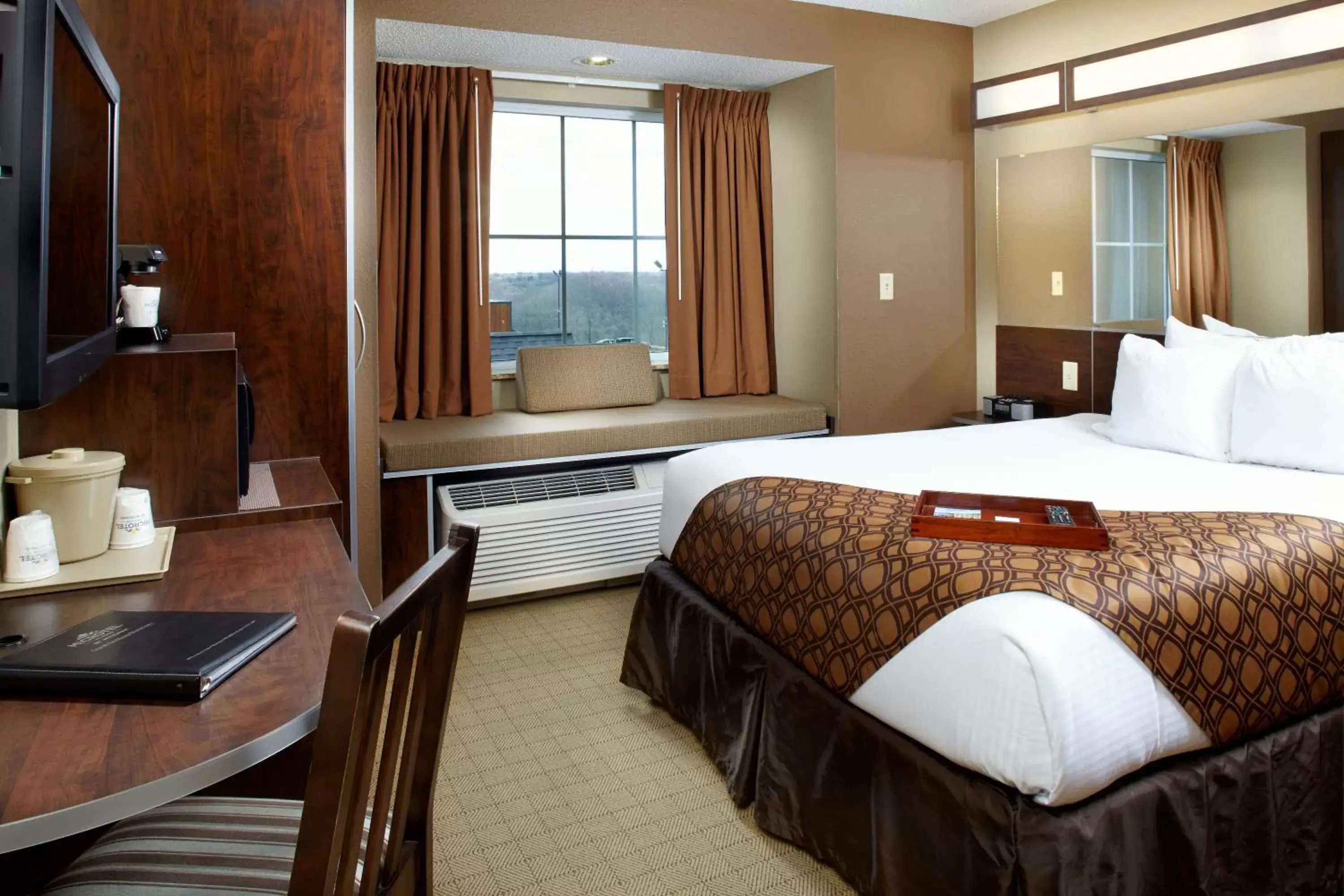 Bed in Microtel Inn & Suites by Wyndham Wheeling at The Highlands