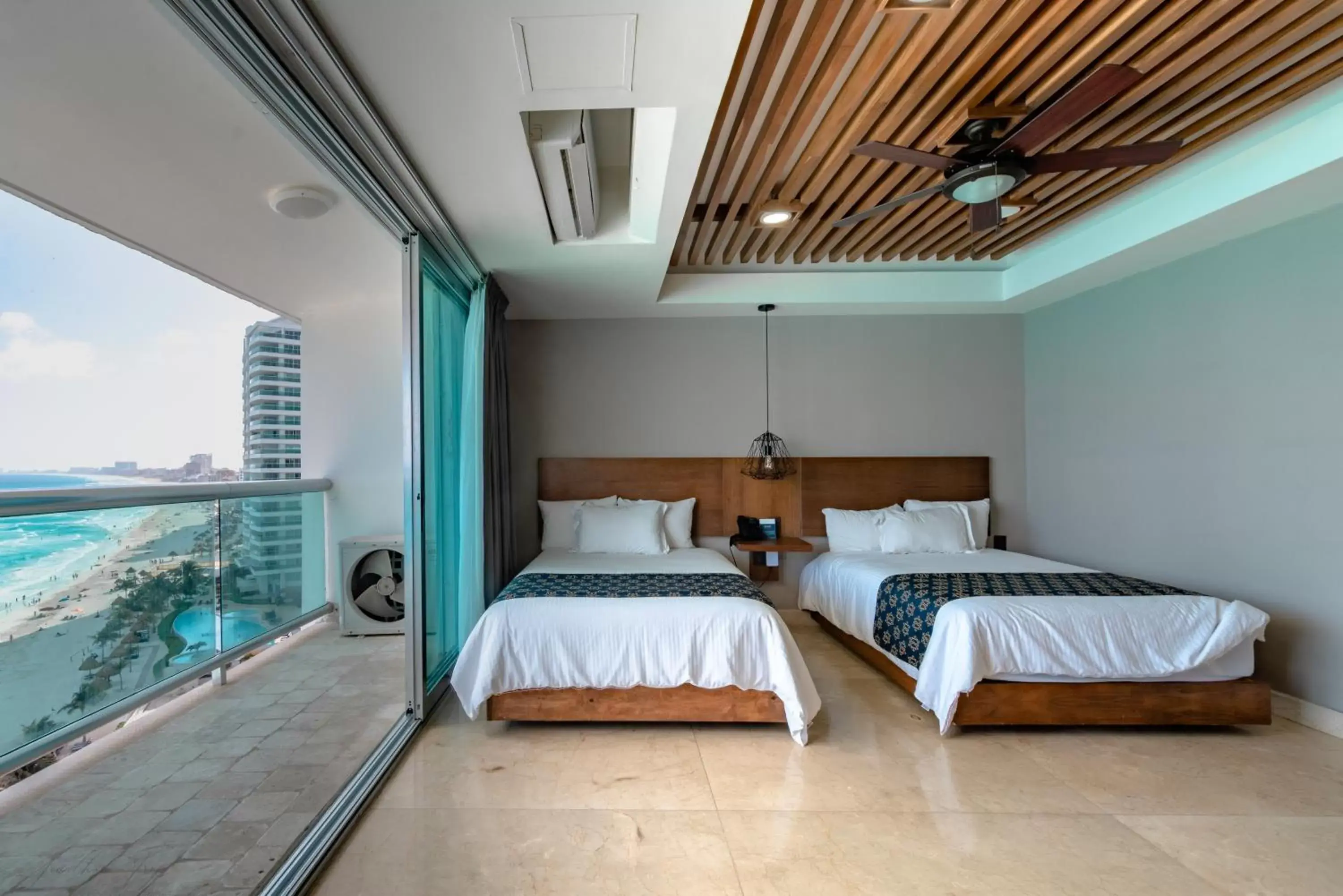 Bed in Ocean Dream Cancun by GuruHotel