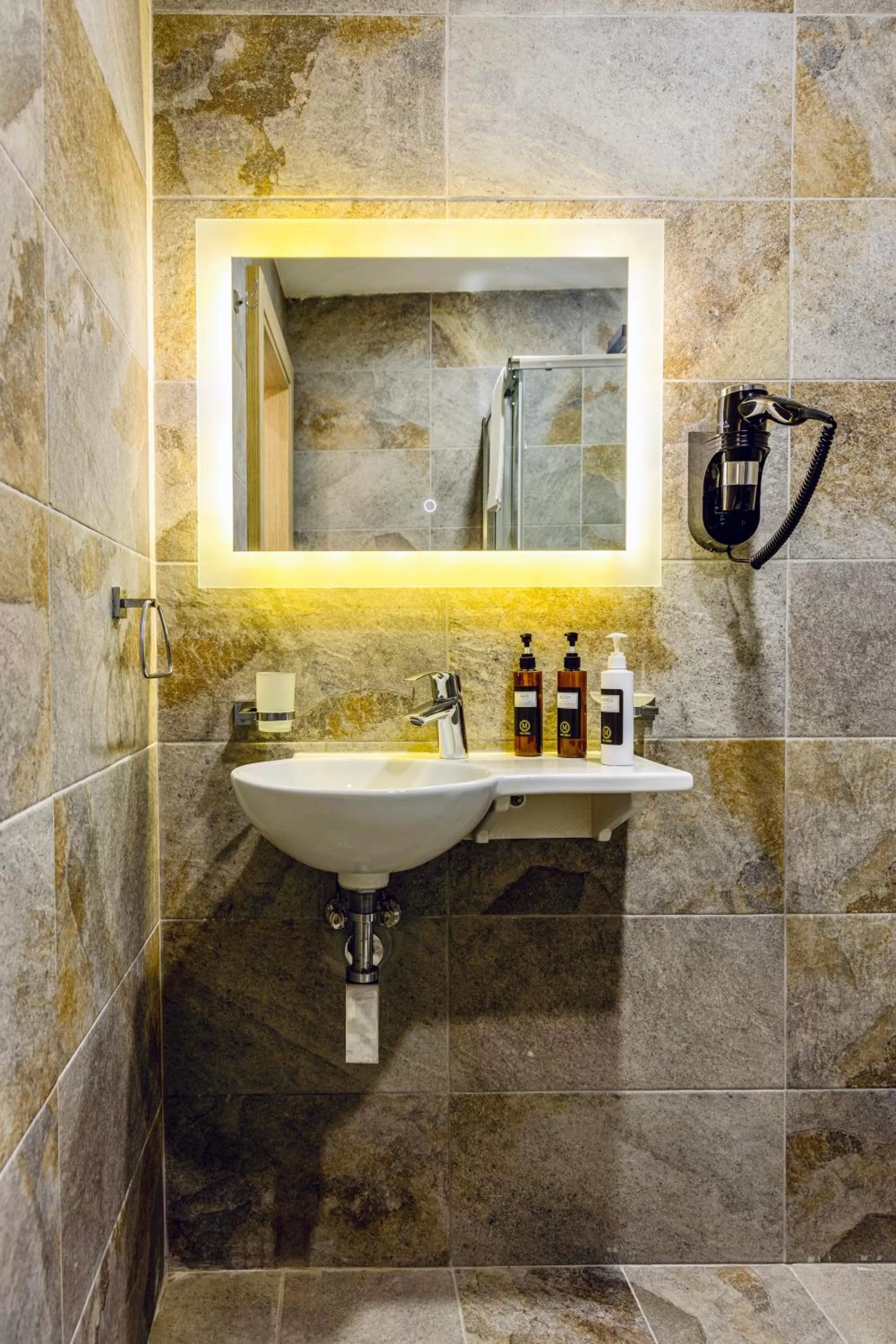 Bathroom in The Mike Hotel by CX Collection