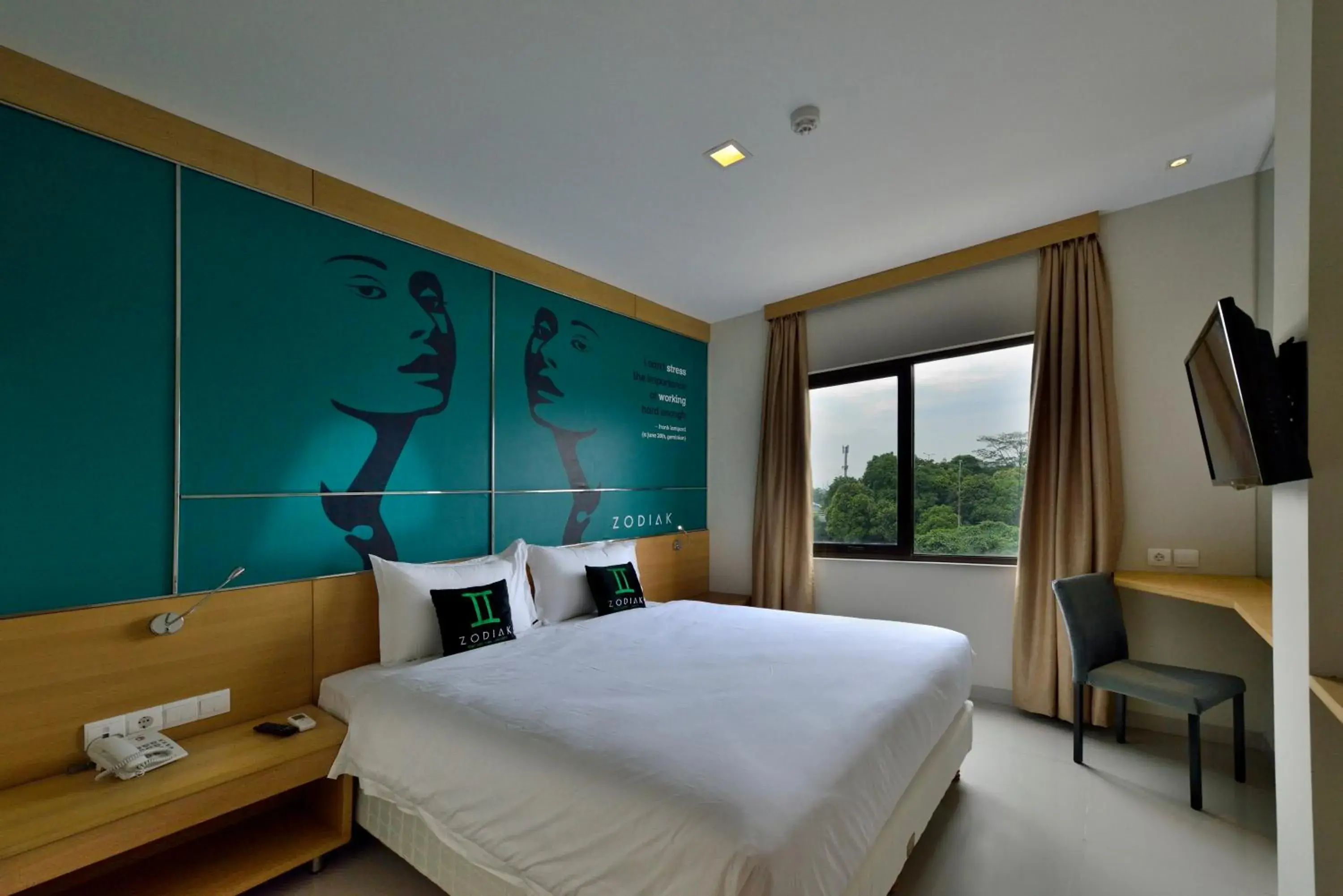 Photo of the whole room in Zodiak MT Haryono by KAGUM Hotels