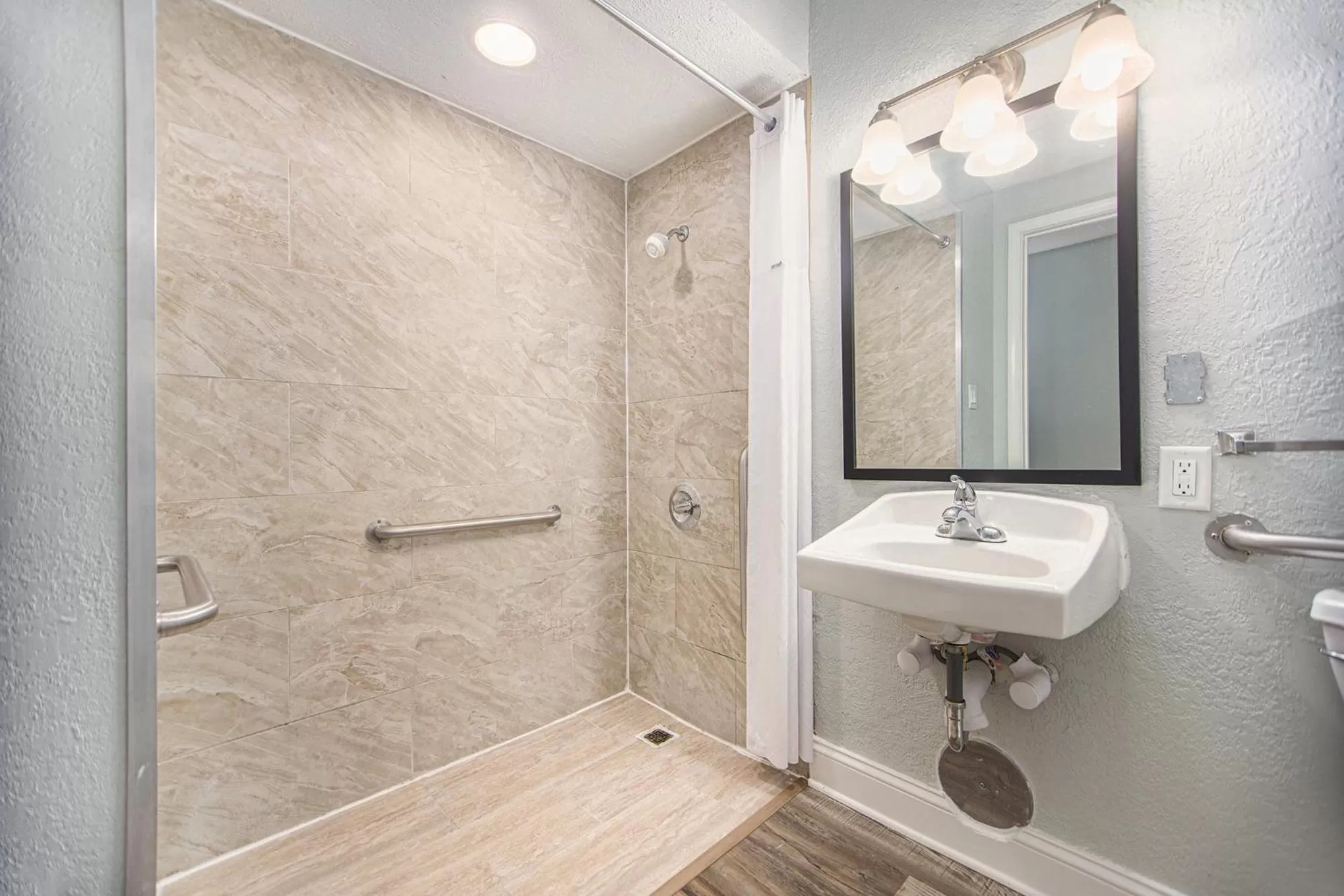 Bathroom in Baymont by Wyndham Grand Haven