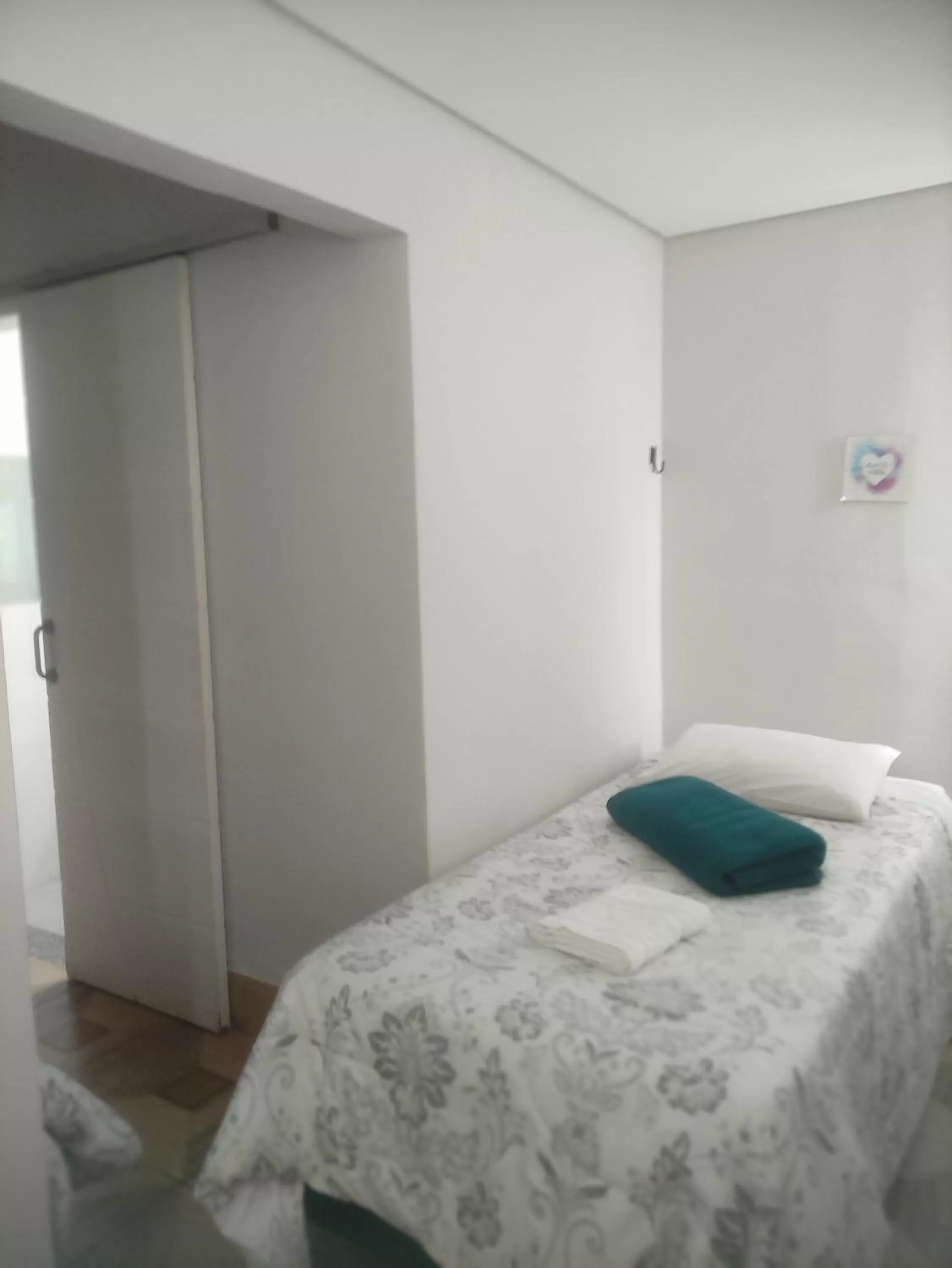 Bed in Pousada da Gi Suítes e Turismo