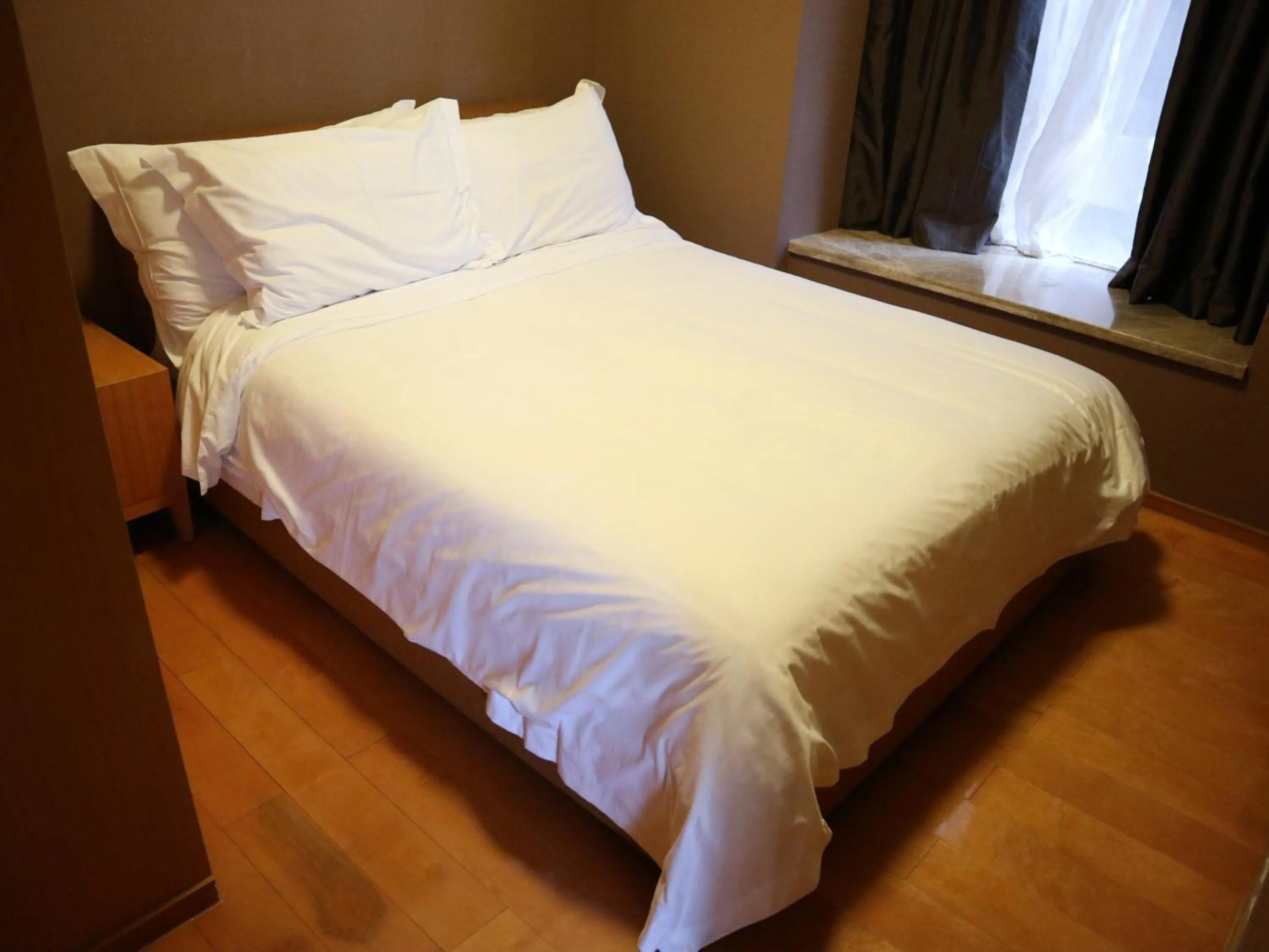 Bed in 广州丹顿行政公寓-珠江新城店