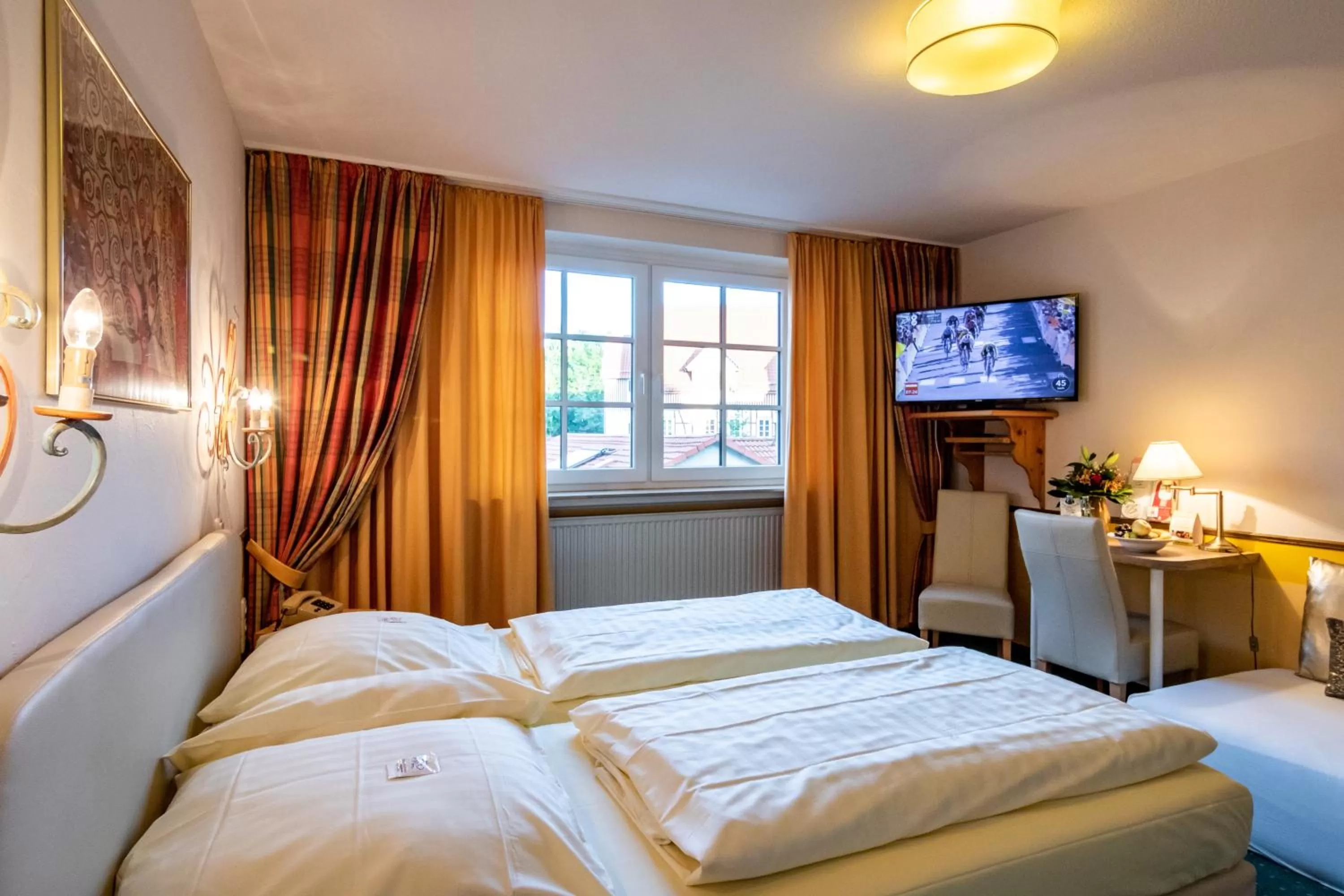 Photo of the whole room, Bed in Hotel Goldflair am Rathaus