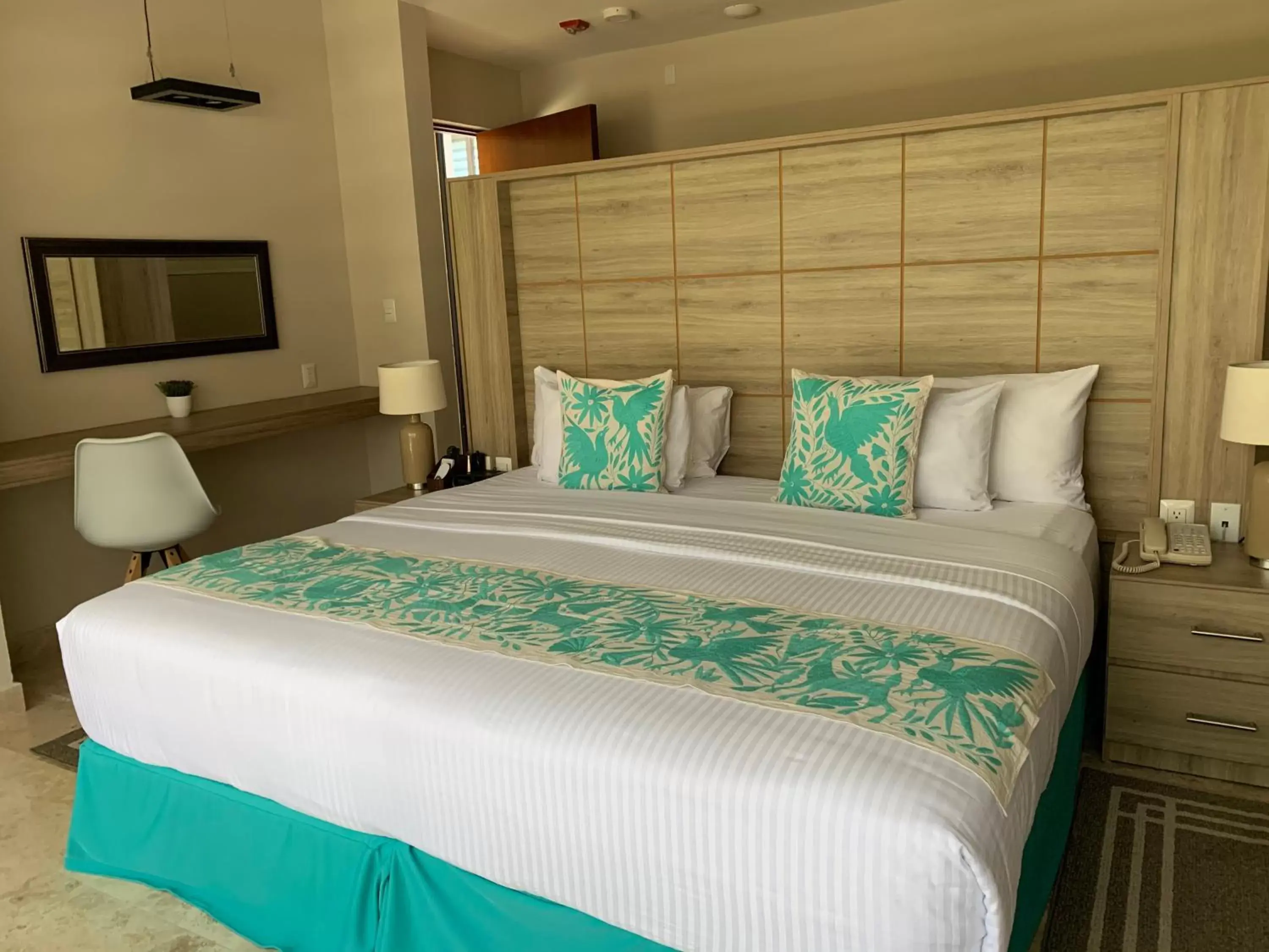 Bed in Xaha Villas Suites & Golf Resort