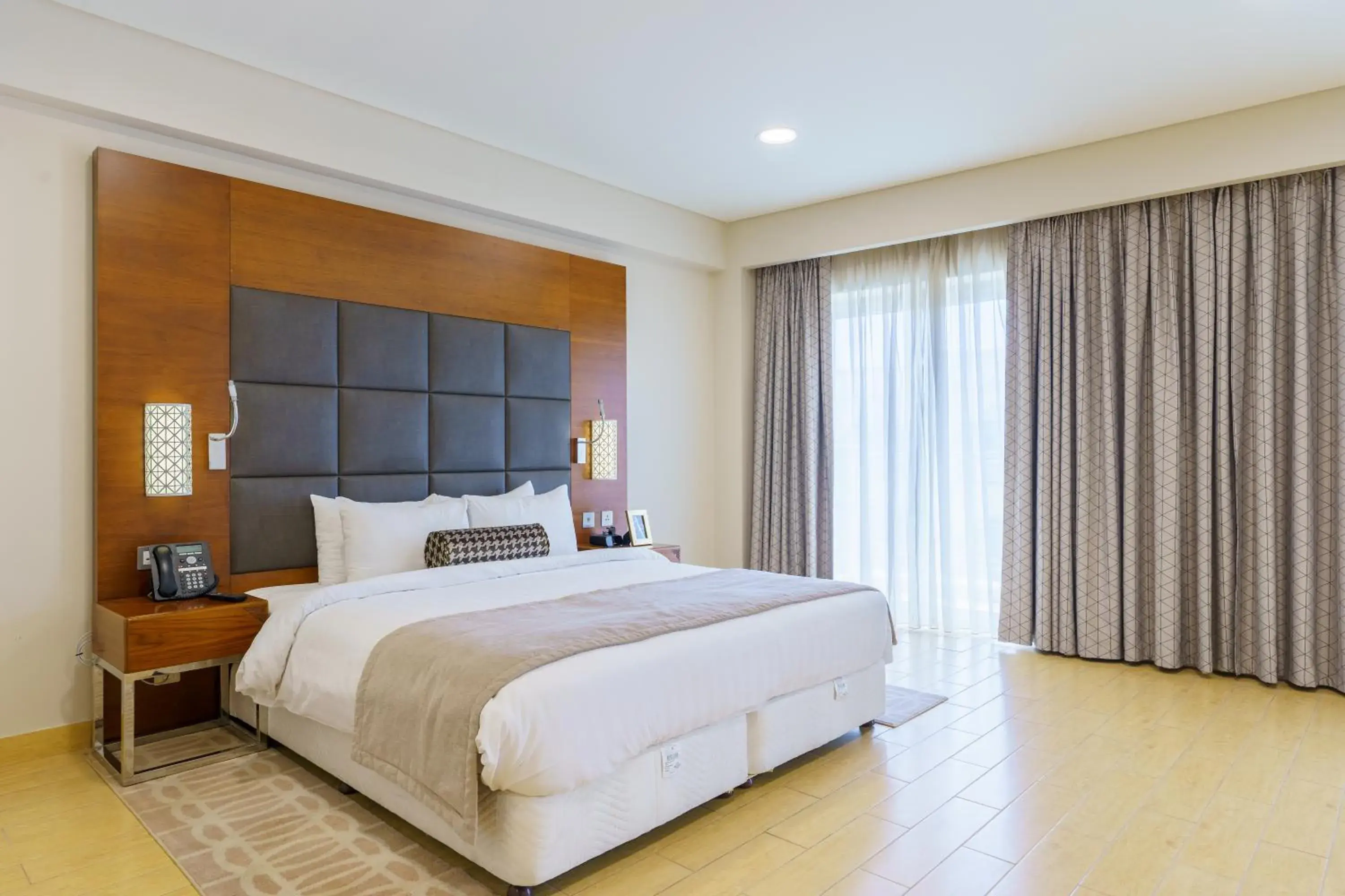 Bed in Levatio Suites Muscat, a member of Radisson Individuals