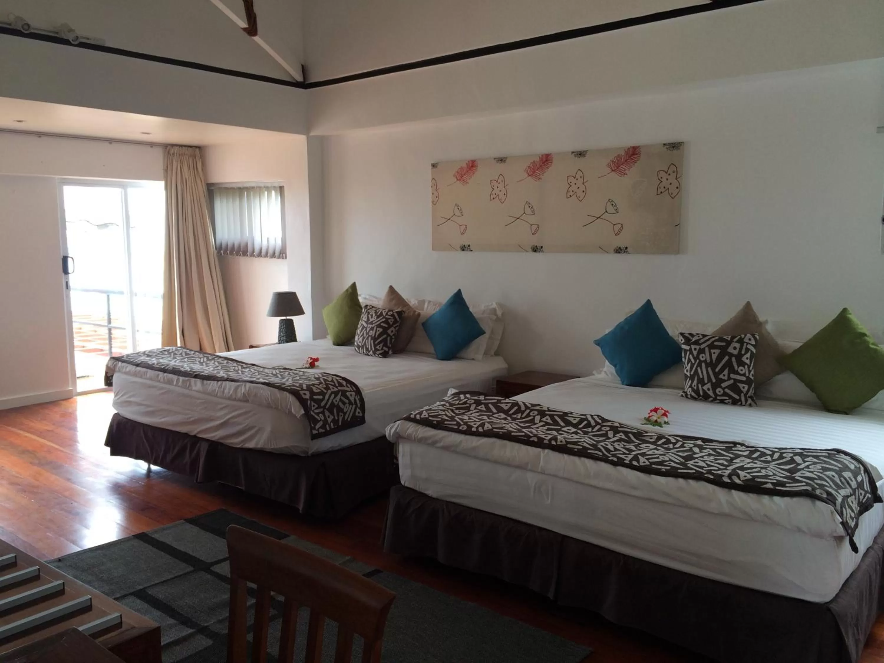 Photo of the whole room, Bed in First Landing Beach Resort & Villas