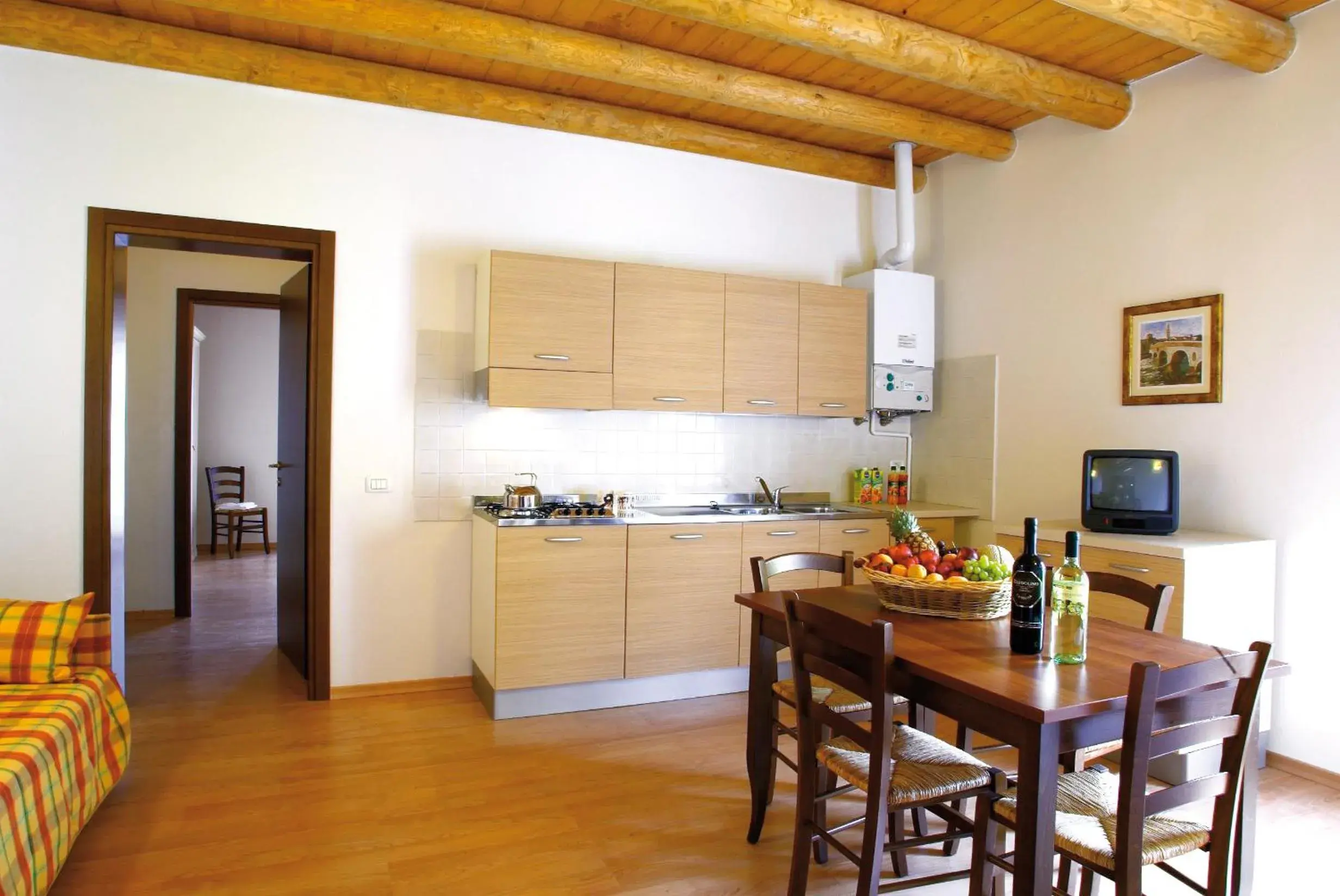 Living room, Kitchen/Kitchenette in Hotel Bella Italia