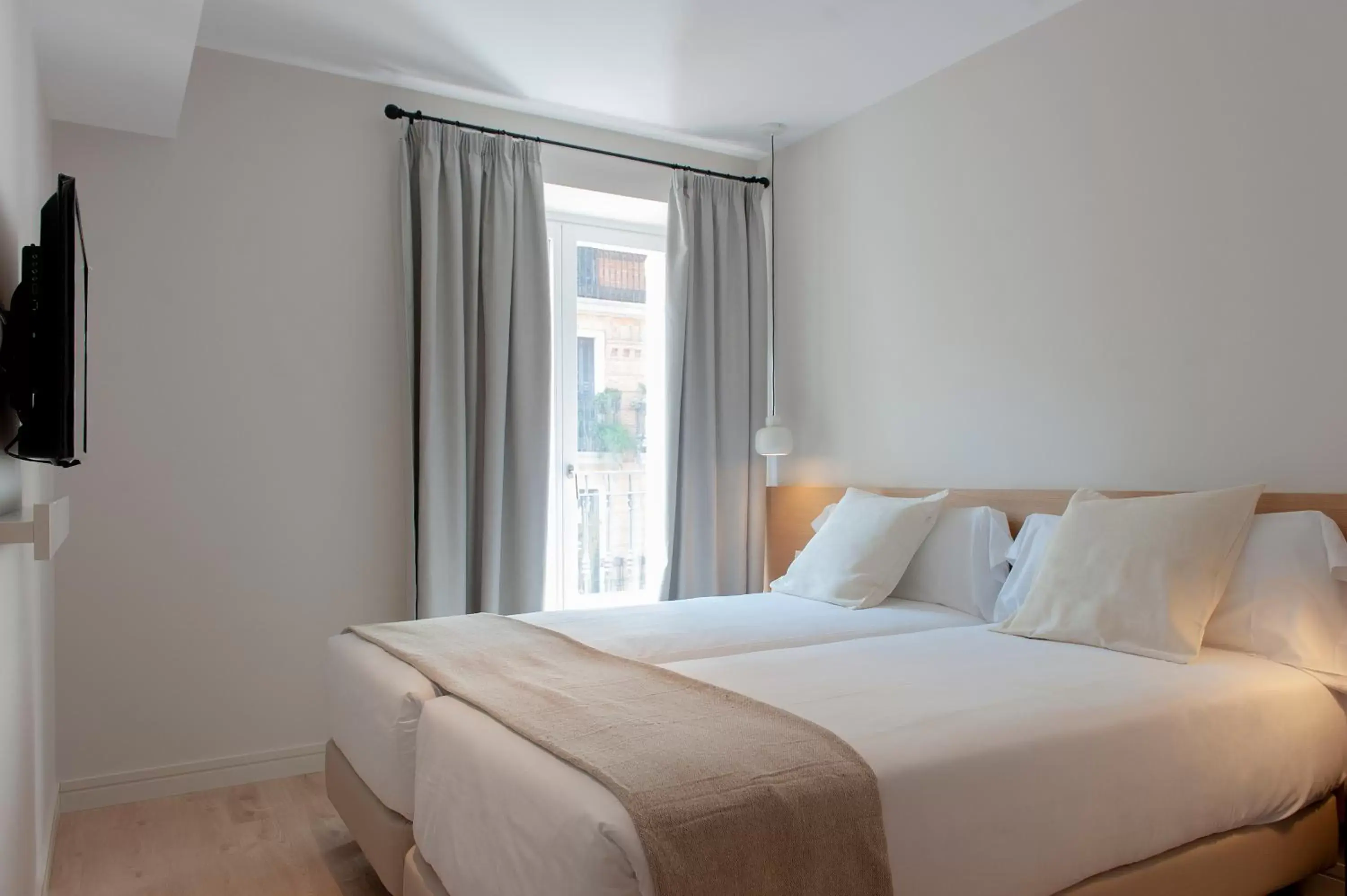Bedroom, Bed in MH Apartments Central Madrid