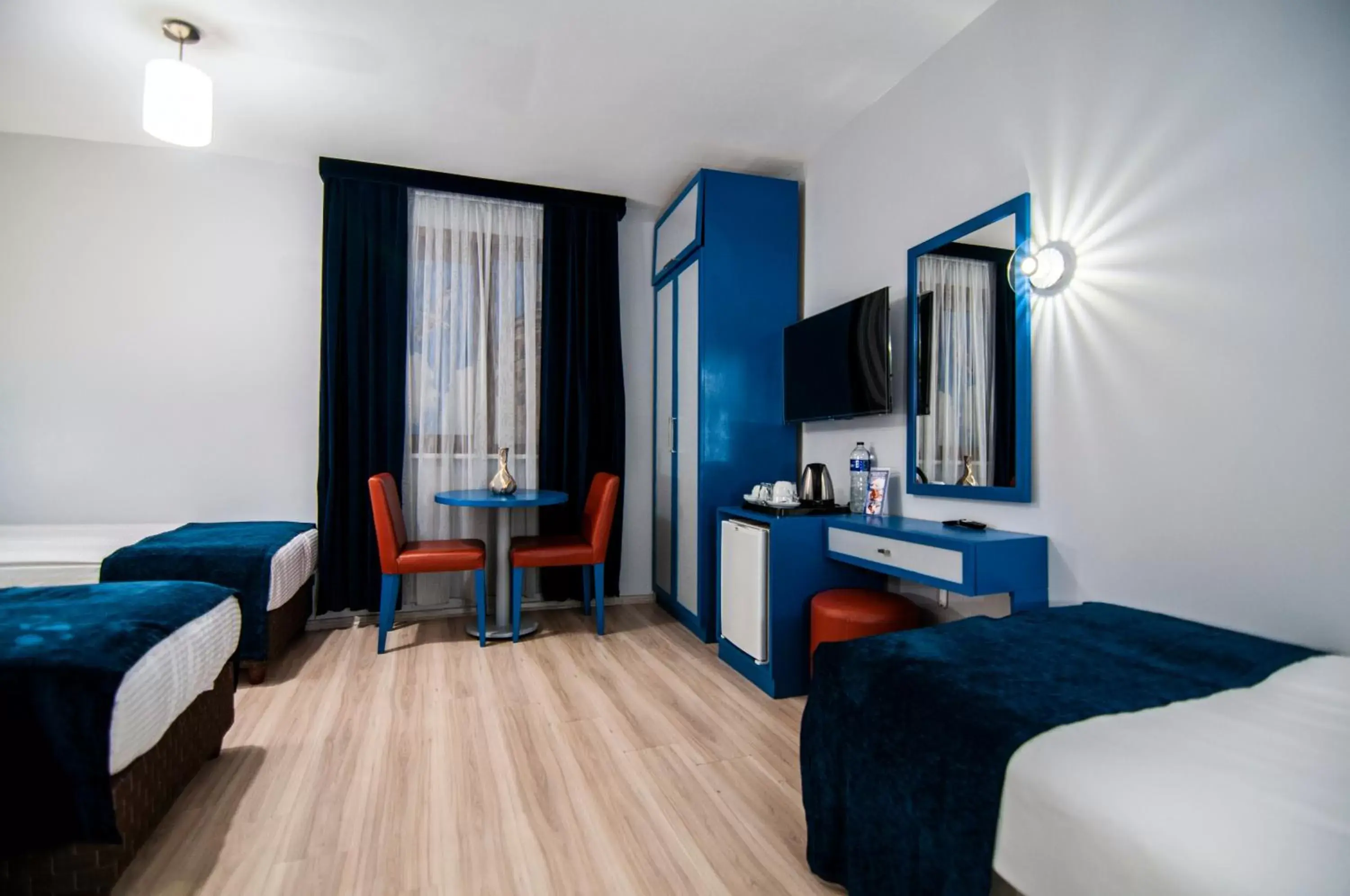 Bed, TV/Entertainment Center in Lapis Inn Hotel & Spa ( Ex. Ambassador Hotel)