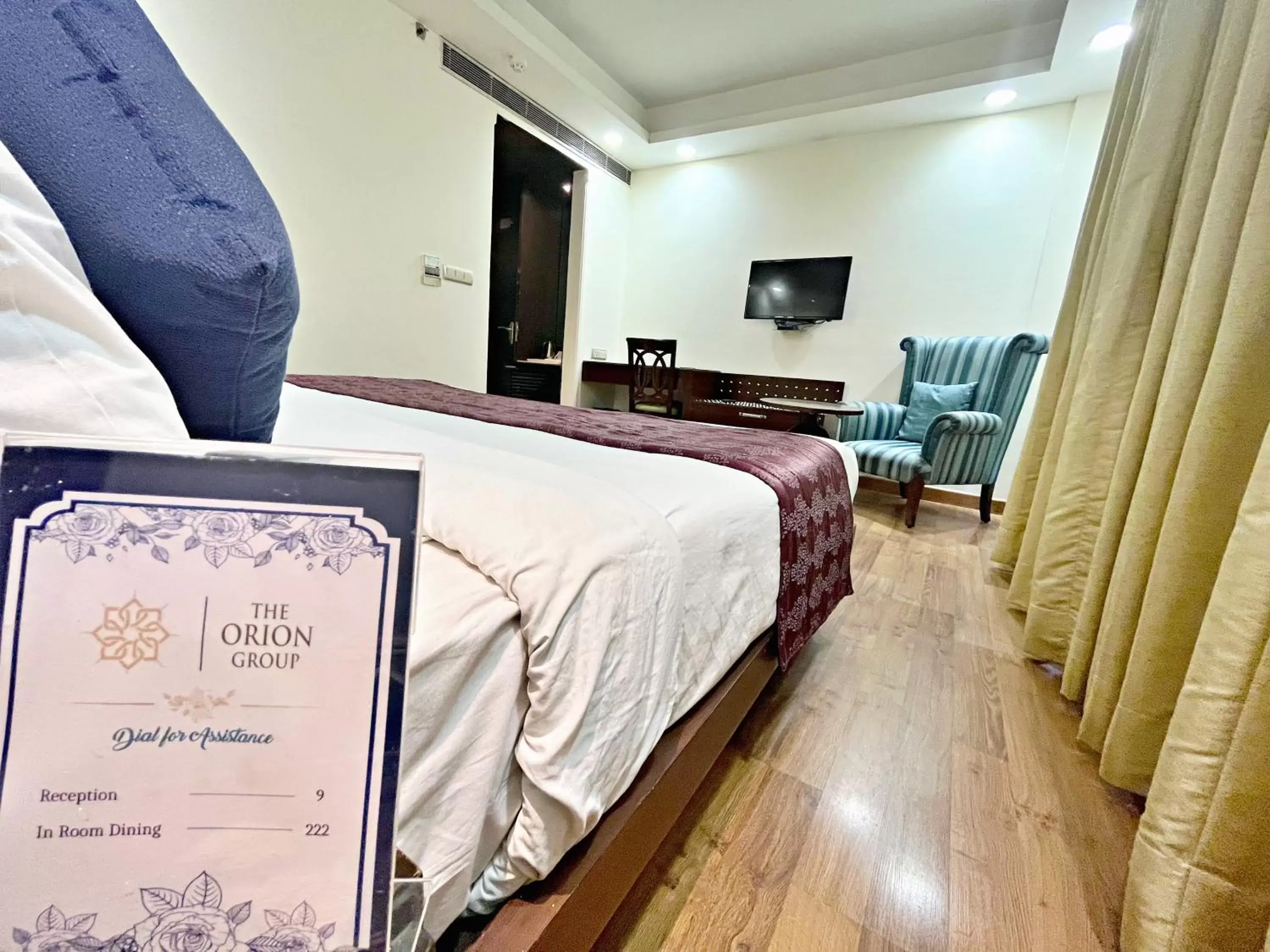 Bed in The Grand Orion - Kailash Colony