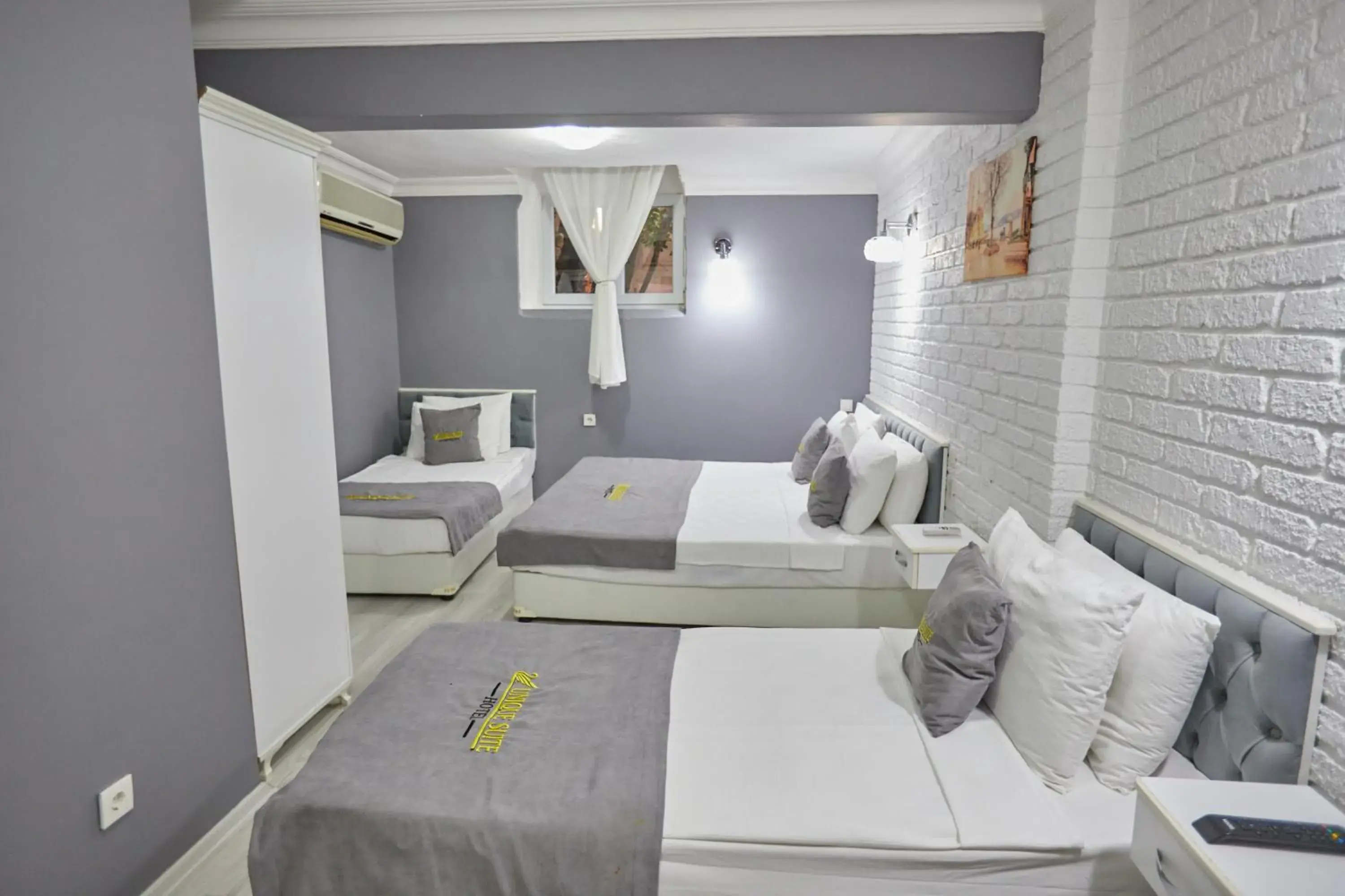 Bed in Unique Suite Hotel