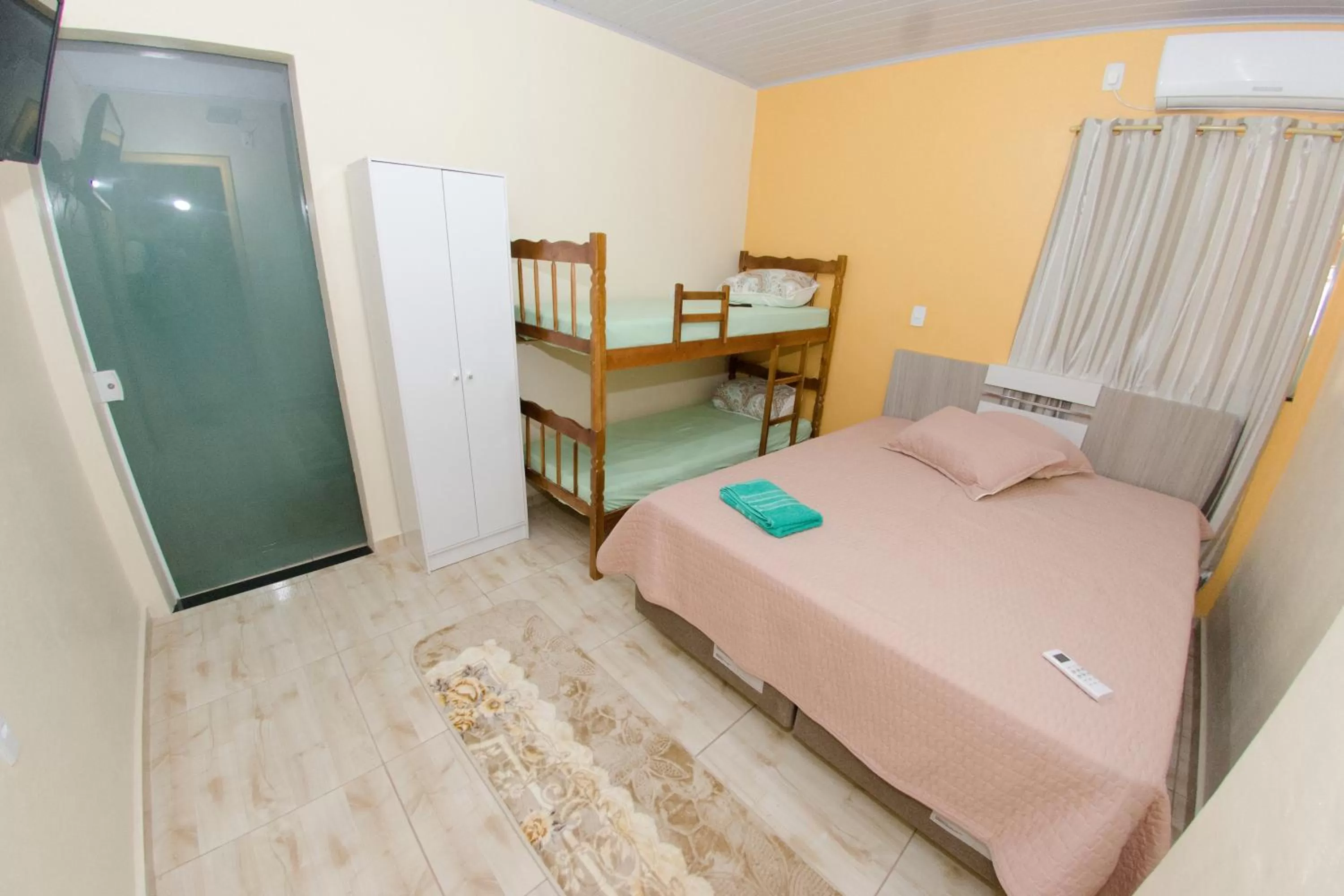 Bed in Pousada Família Cordeiro