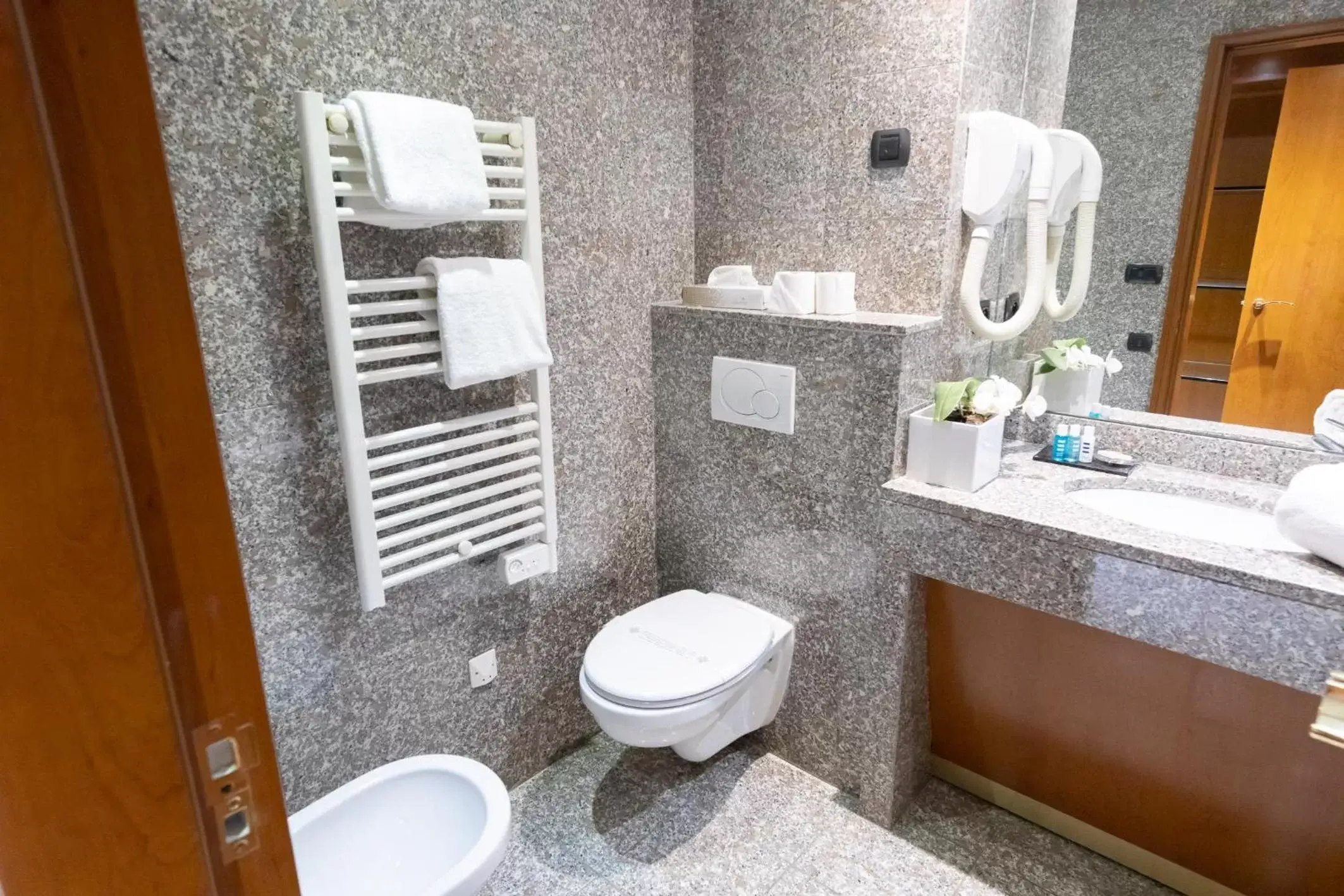 Shower, Bathroom in Goldstar Apartments & Suites