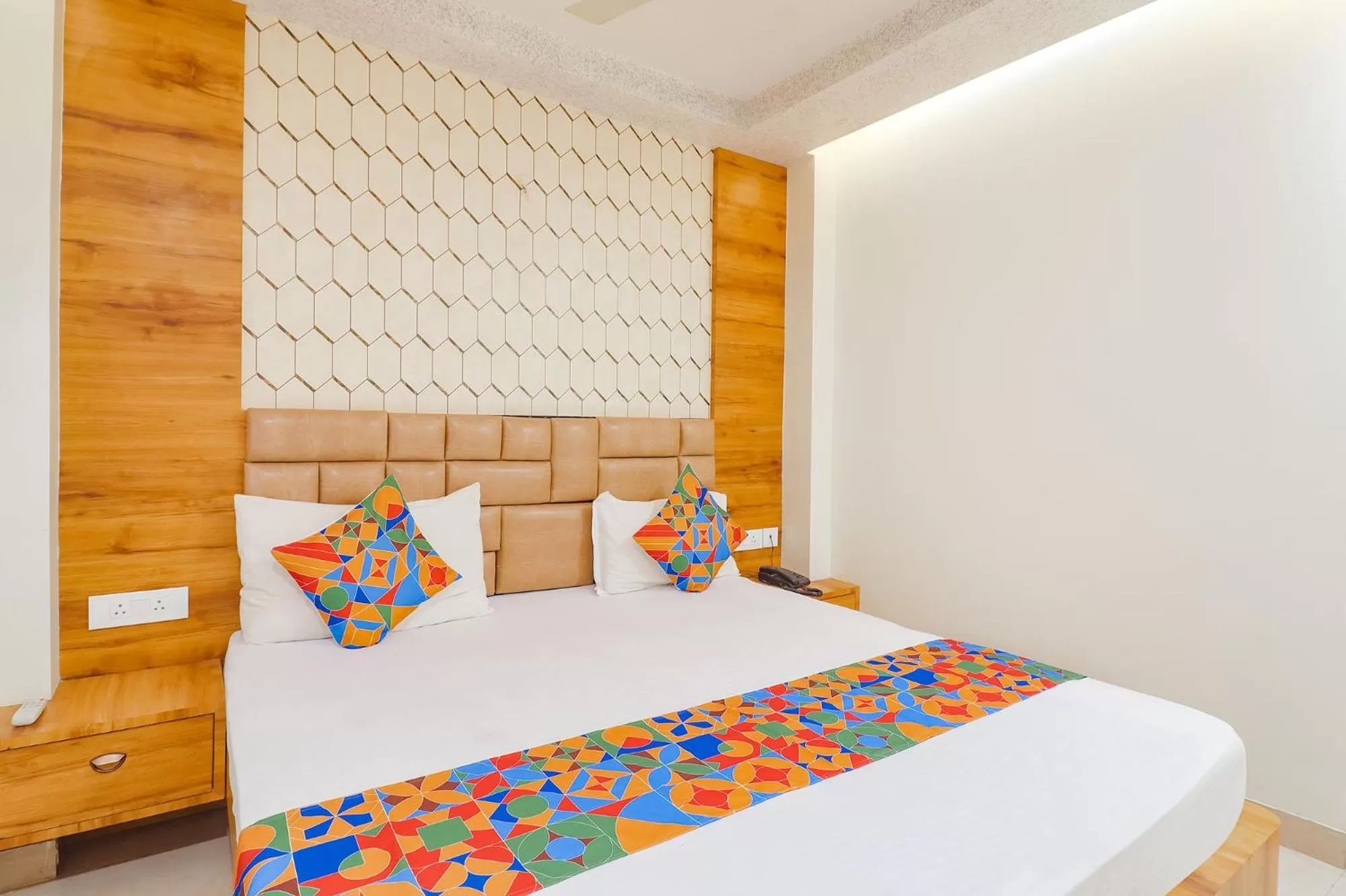 Bed in FabHotel Holiday Grand