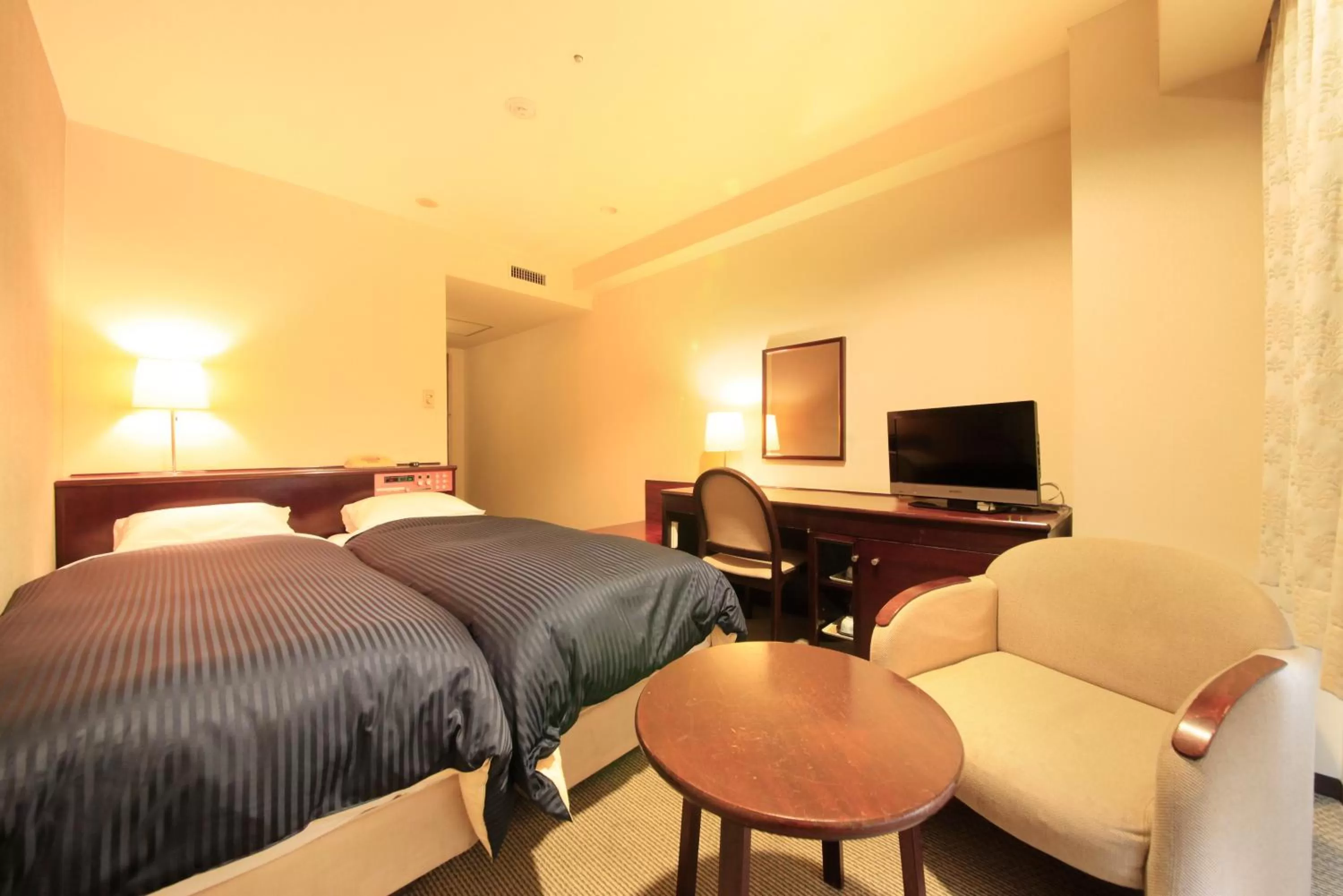 Photo of the whole room, Bed in Quintessa Hotel Ogaki