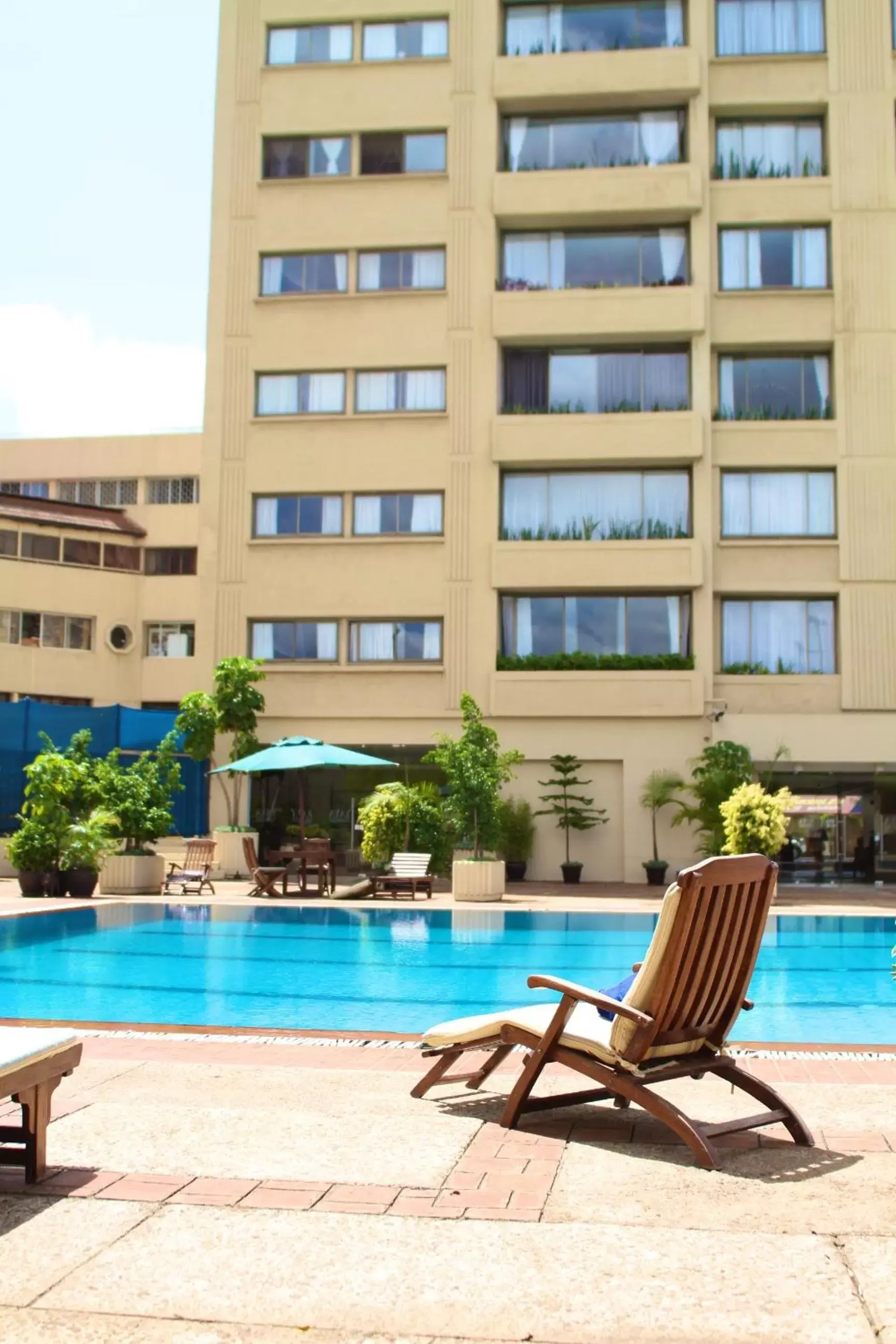 Swimming pool, Property Building in Yaya Hotel & Apartments