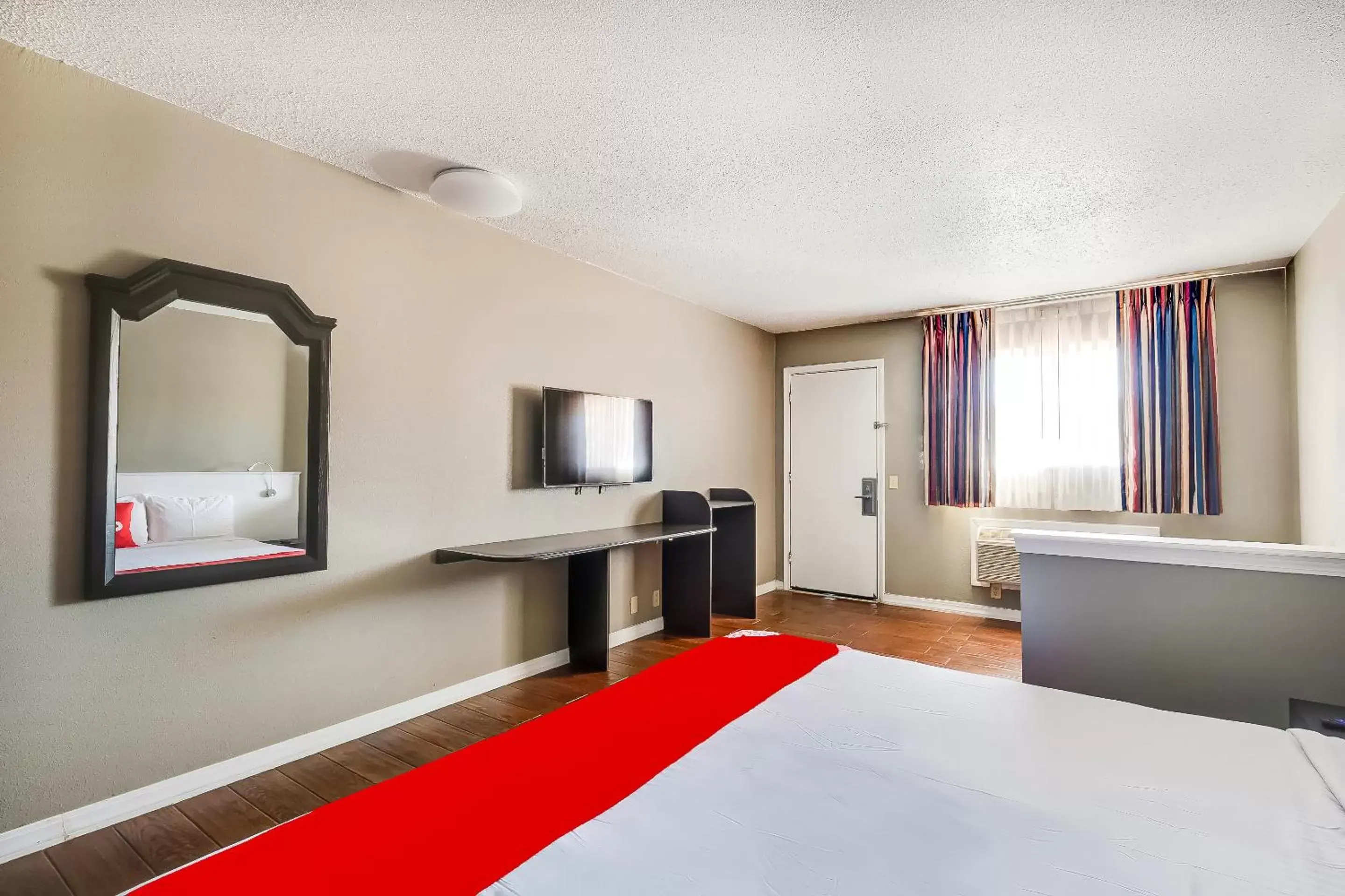 Bedroom, TV/Entertainment Center in OYO Hotel Elk City OK Route 66