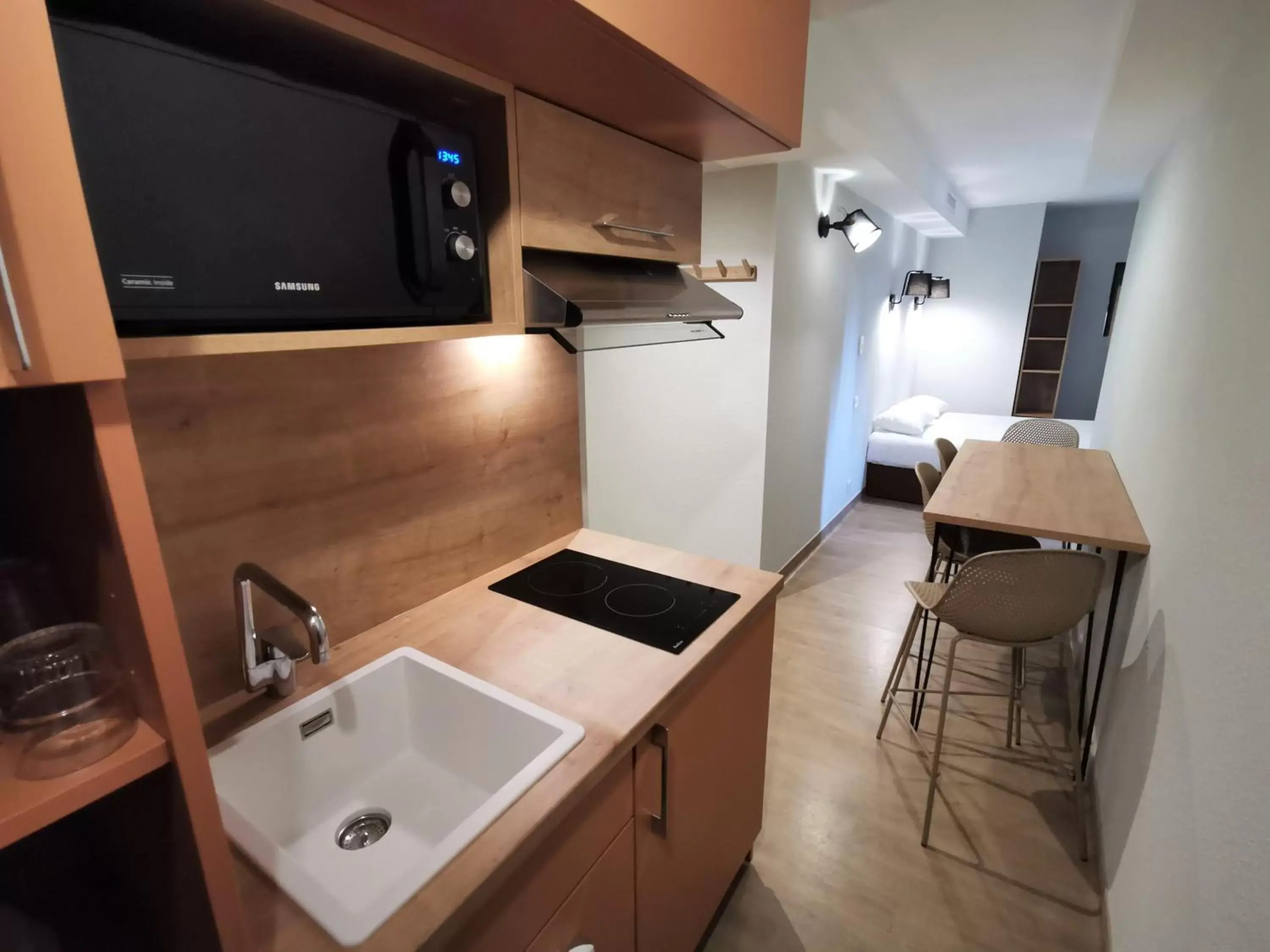 Kitchen/Kitchenette in Apparthotel Torcy