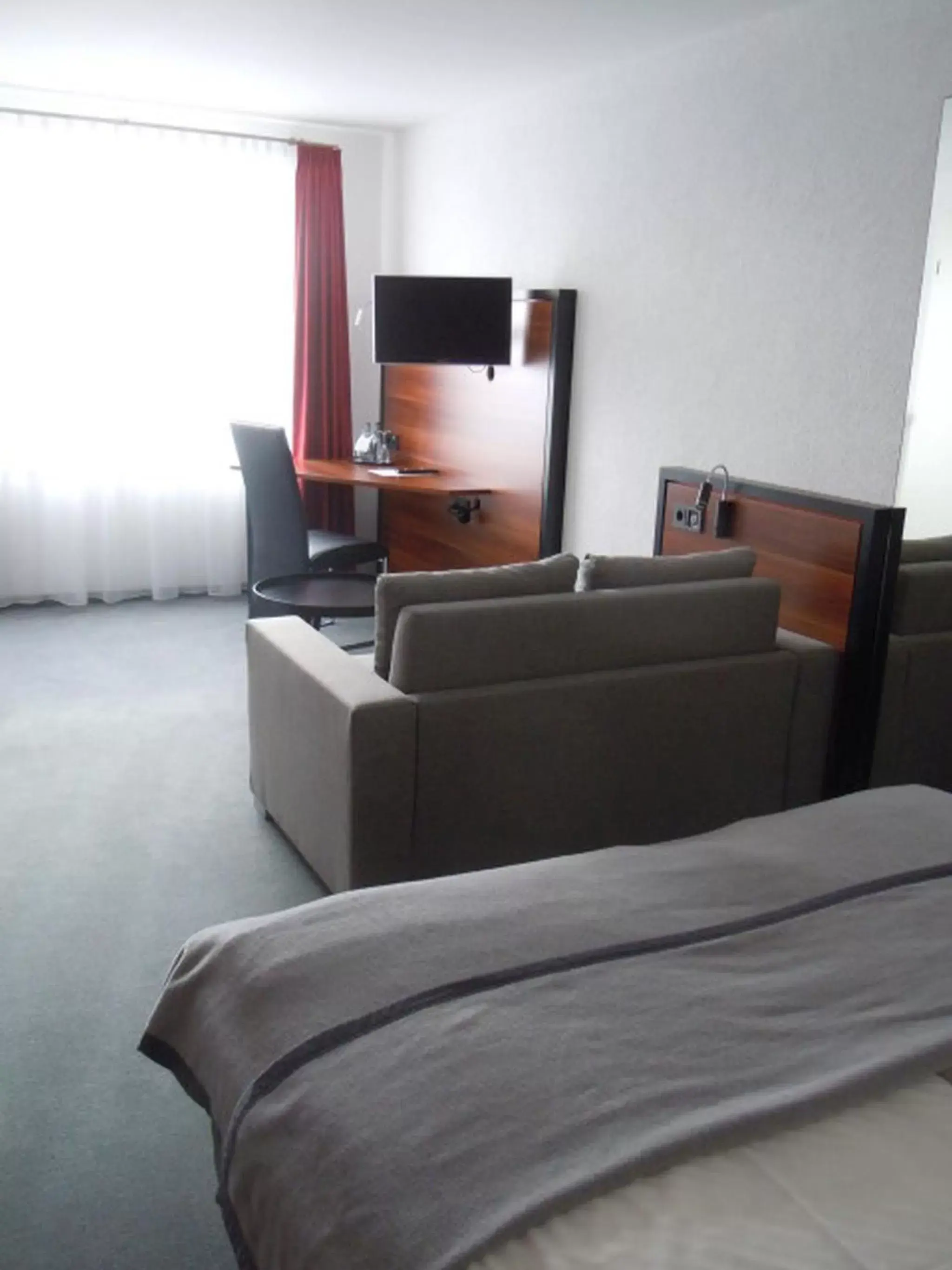 Photo of the whole room, Seating Area in Allgäuhotel Memmingen Nord