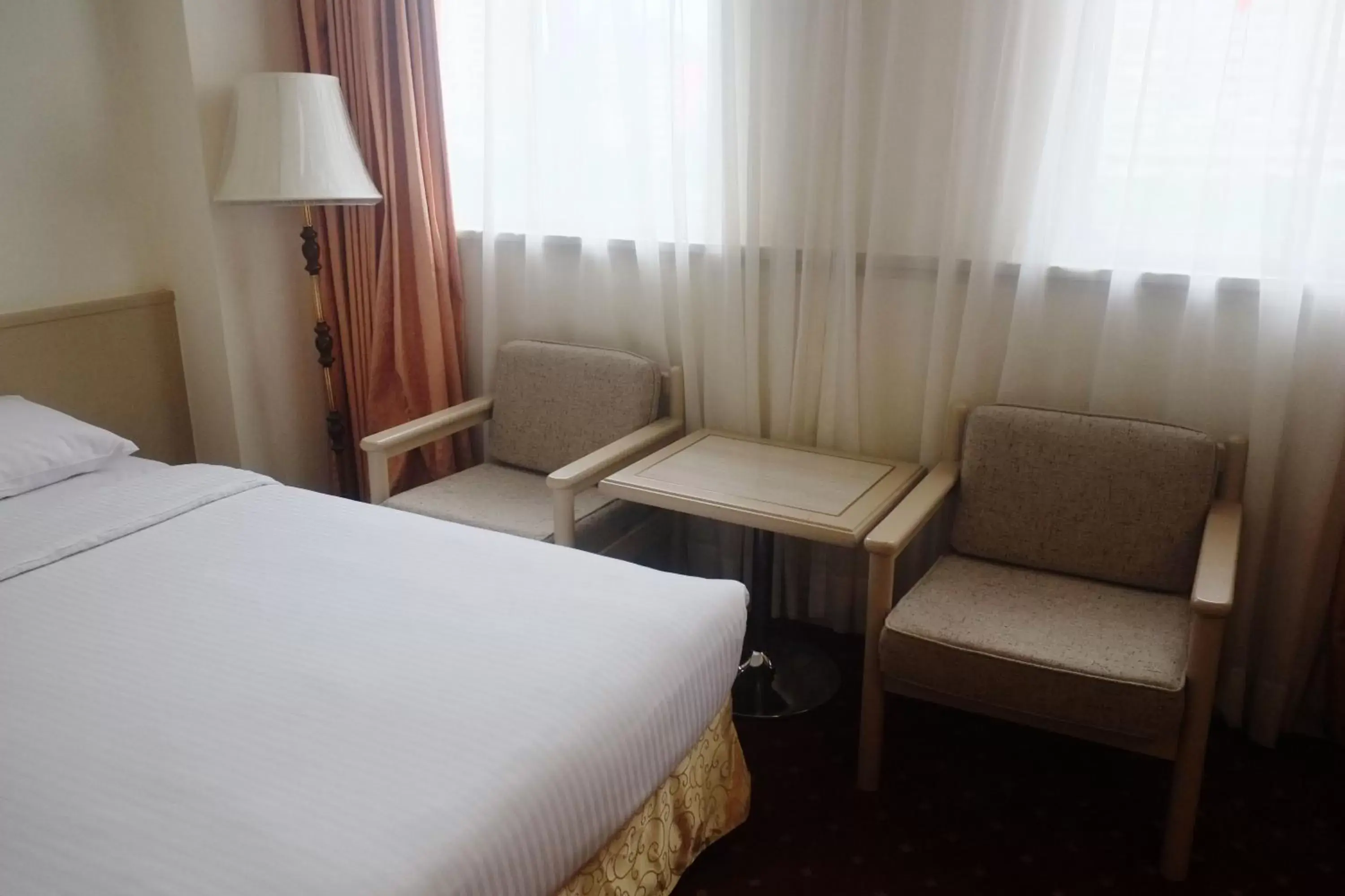 Bed, Seating Area in Emperor Hotel