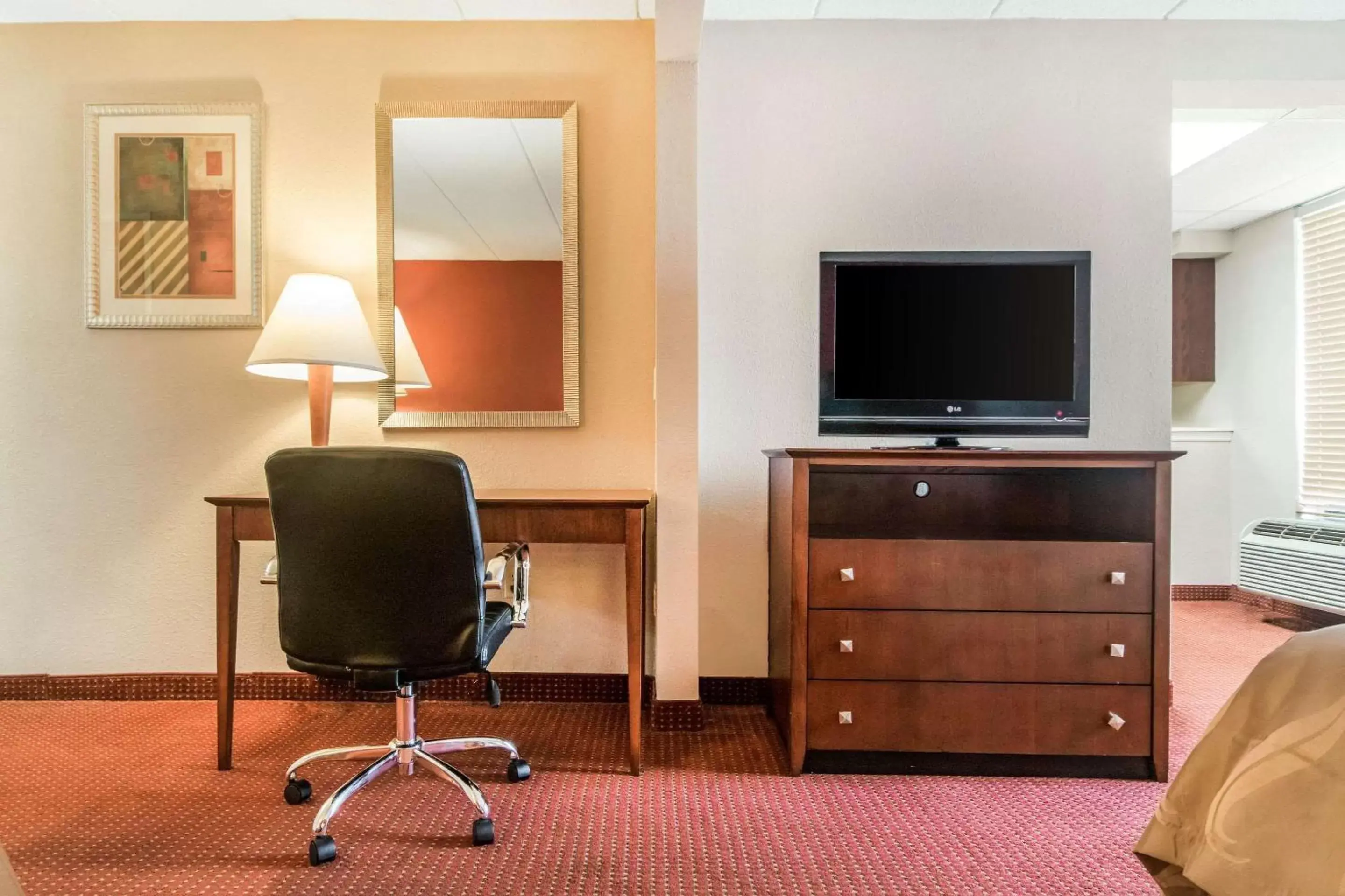 Photo of the whole room, TV/Entertainment Center in Quality Inn & Suites