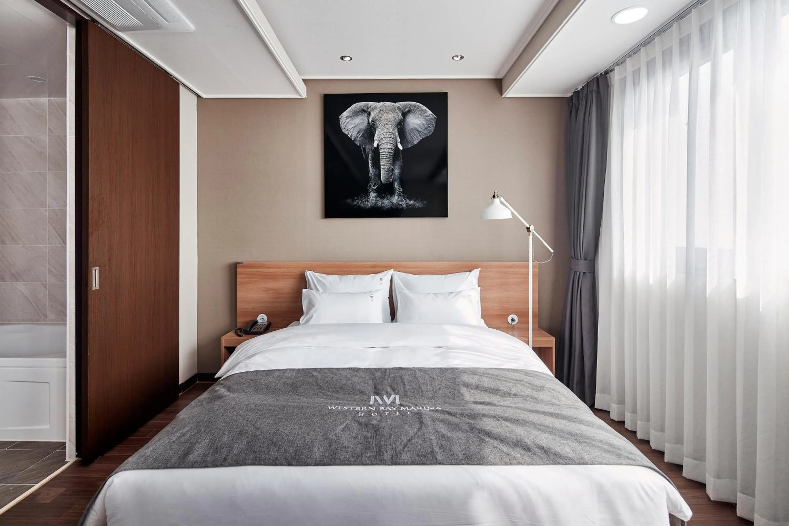 Bed in Western Bay Marina Hotel