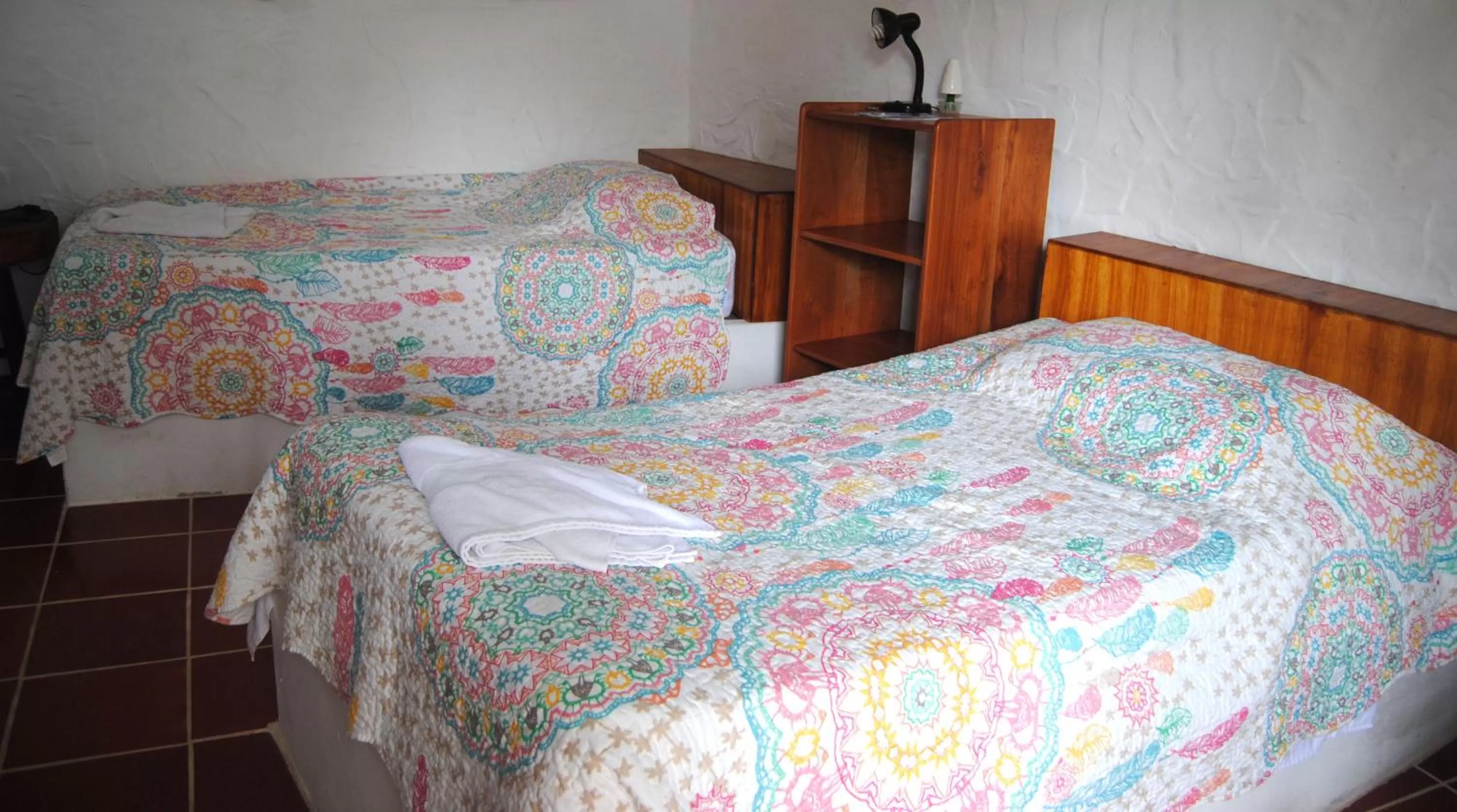 Bed in Hostal Galapagos by Bar de Beto
