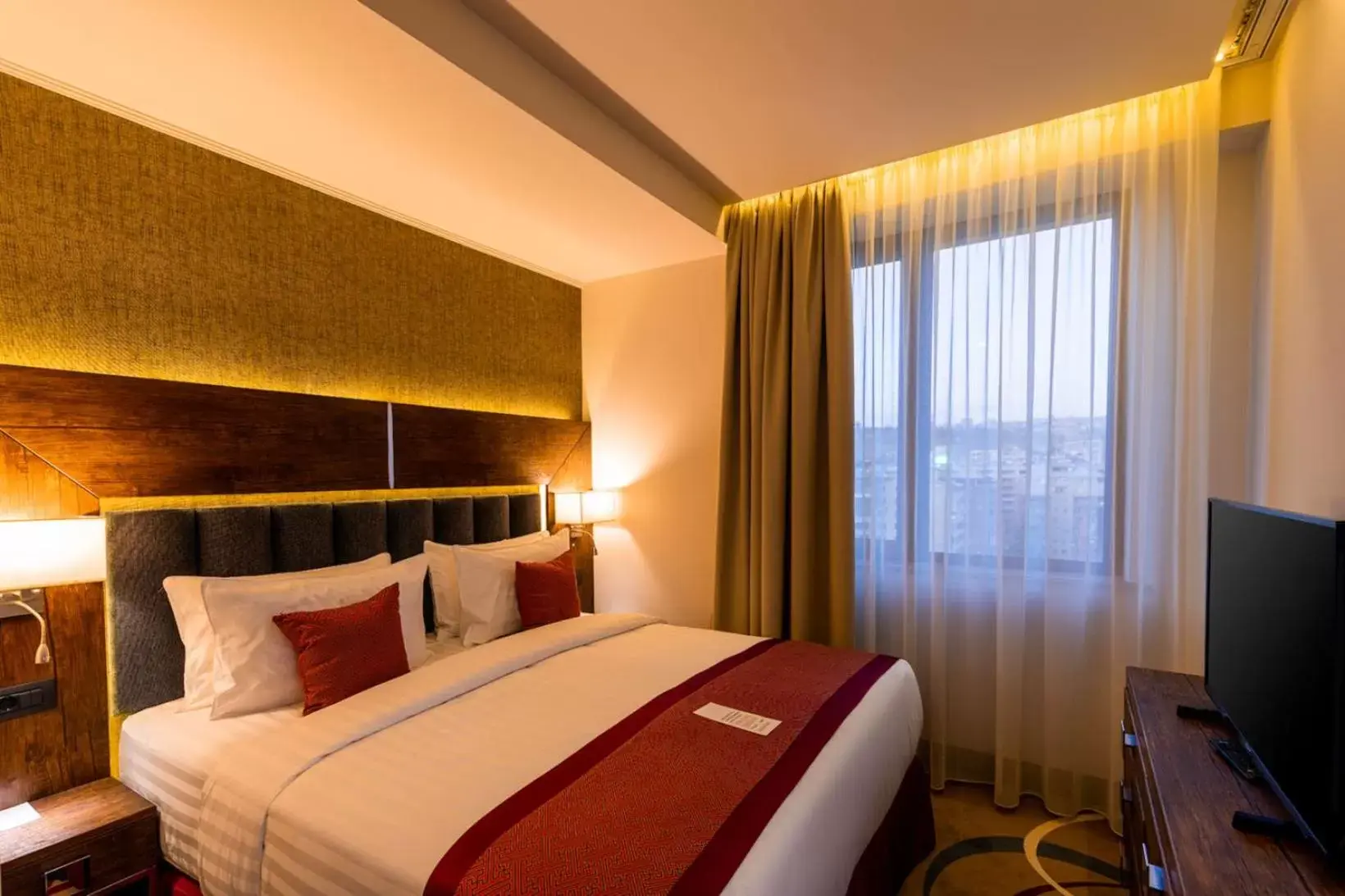Bed in Ramada Hotel & Suites by Wyndham Yerevan