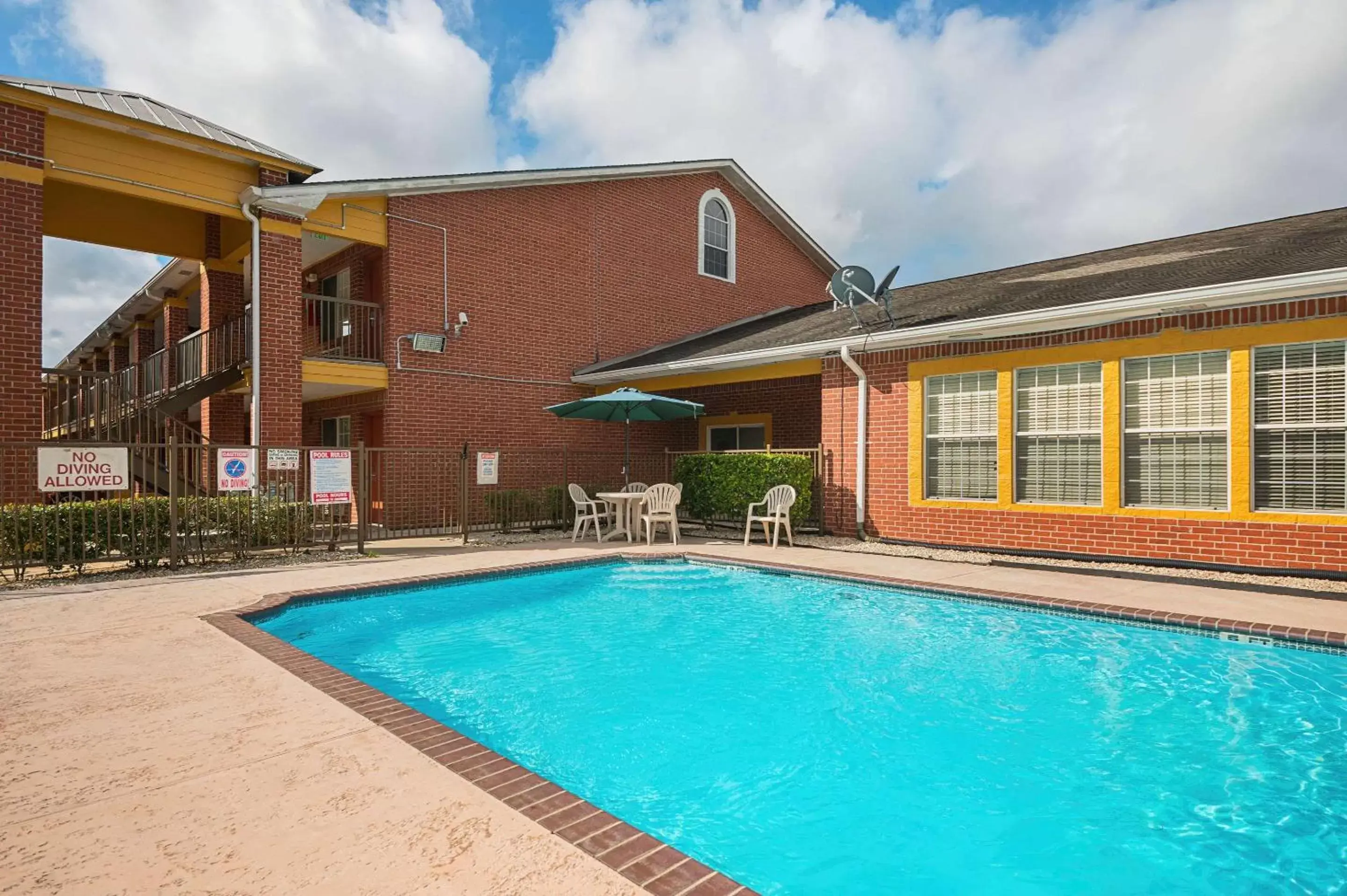 Pool view, Property Building in Quality Inn