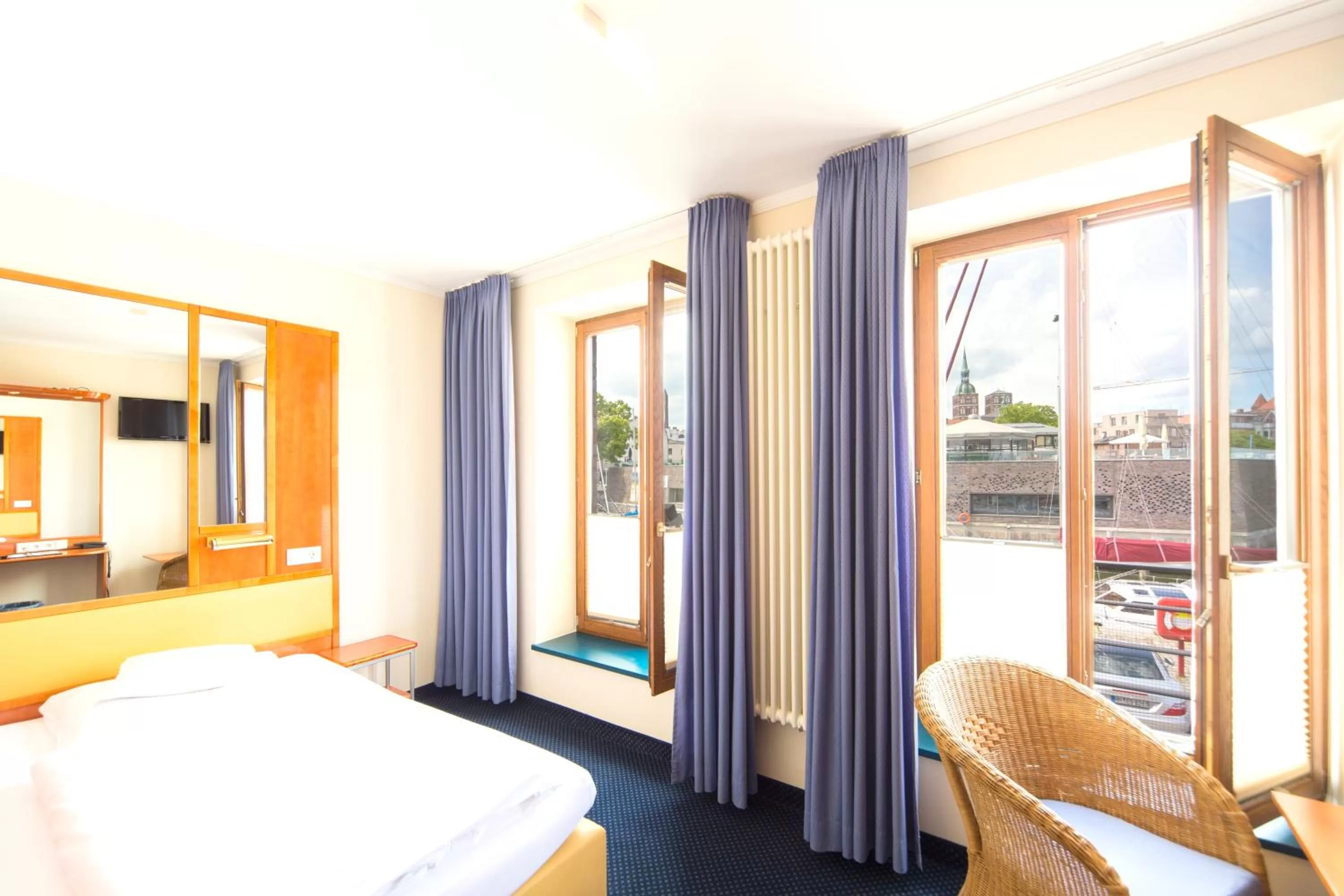 Photo of the whole room, Bed in Hotel Kontorhaus Stralsund