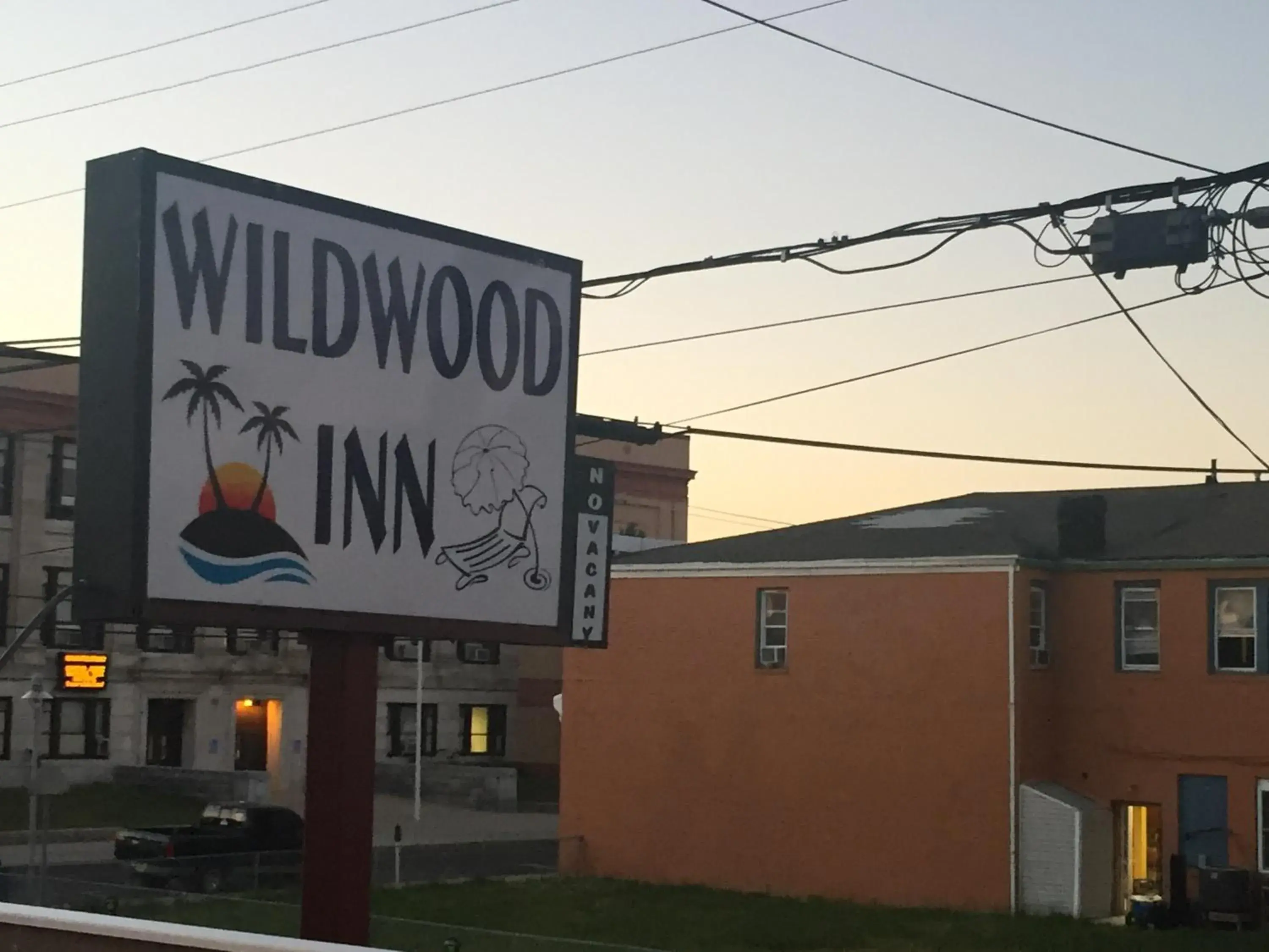 Property logo or sign, Facade/Entrance in Wildwood Inn, a Travelodge by Wyndham