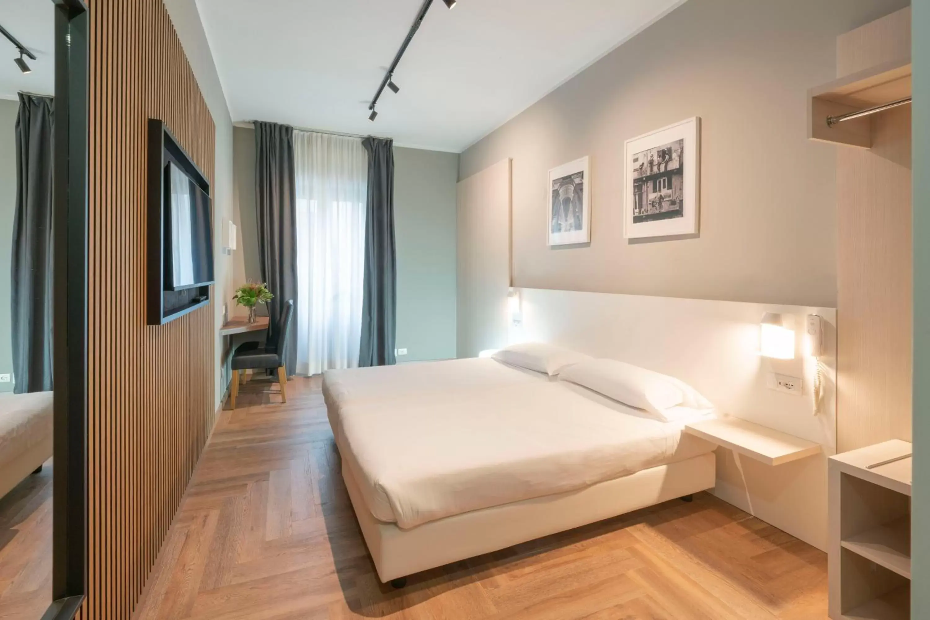 Bed in Kleos Hotel Milano