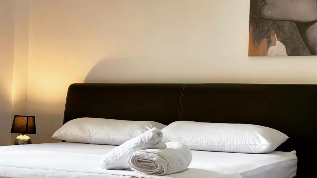 Bed in Hotel Ambasador Garden