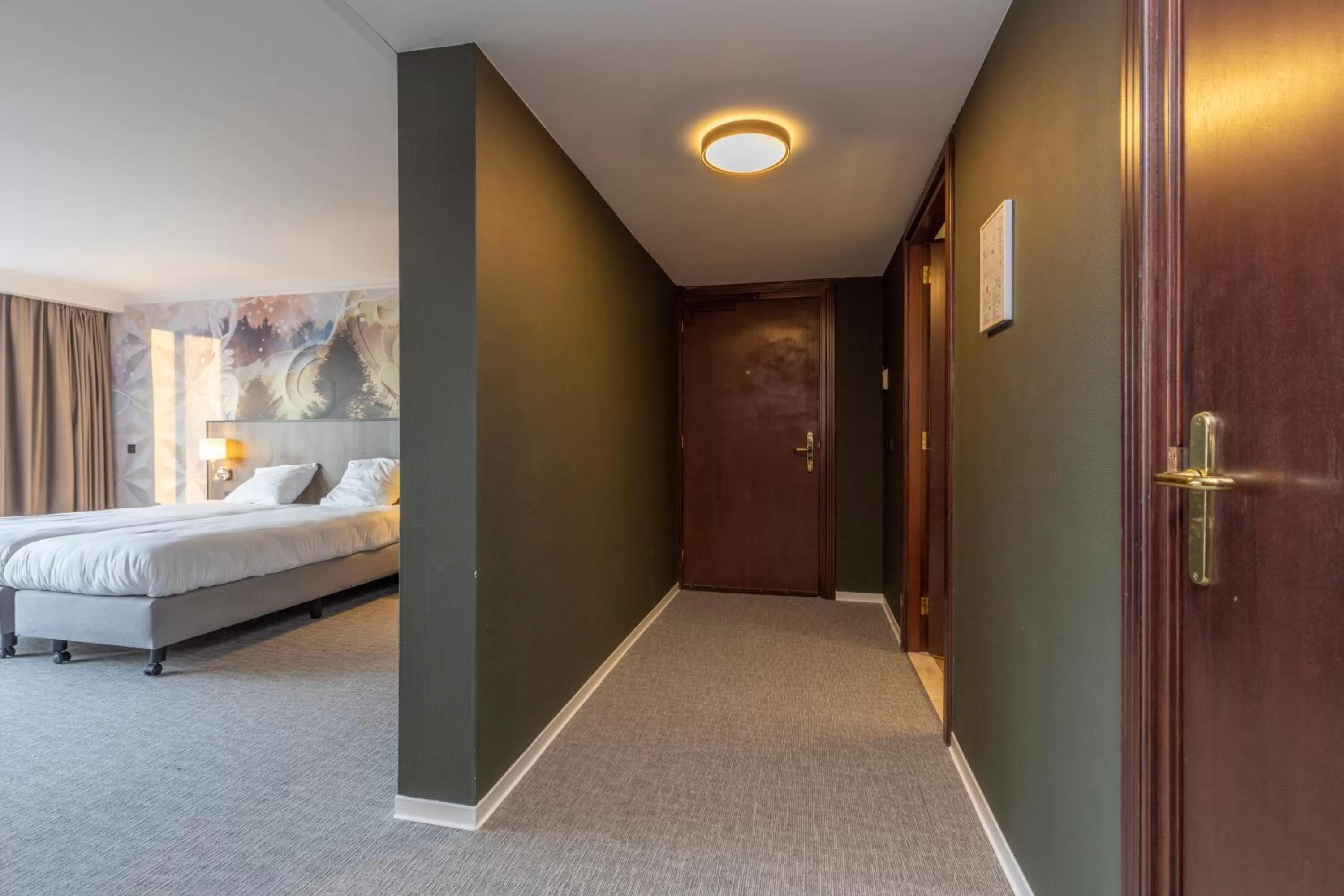 Bed in Fletcher Familiehotel De Hunzebergen