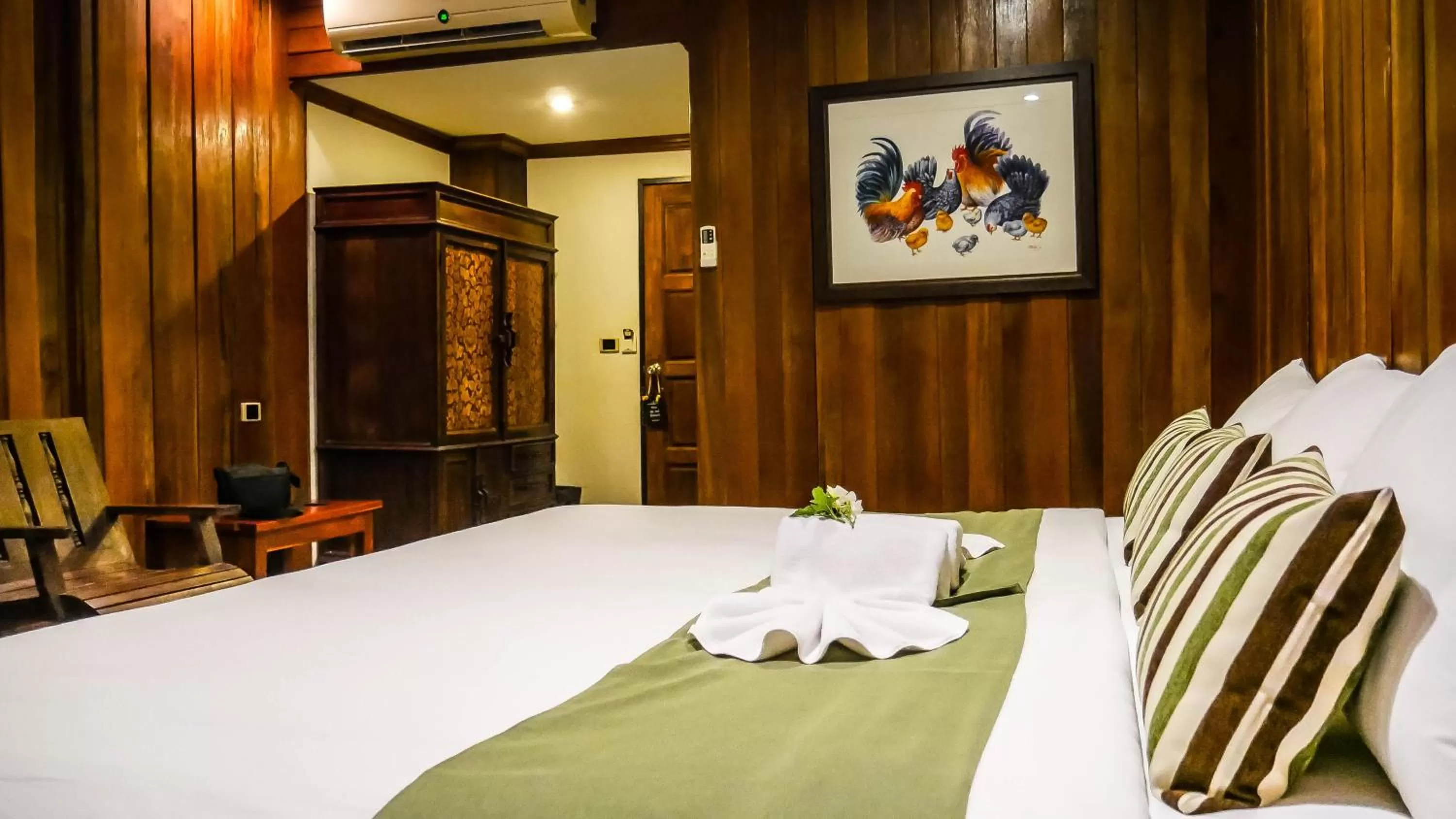 Bed in Royal River Kwai Resort and Spa